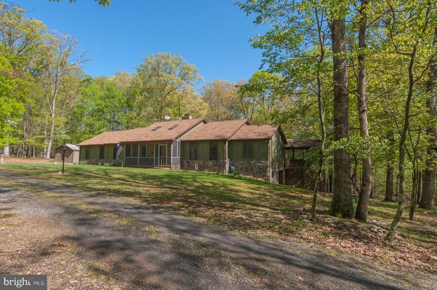 One level home uniquely suitable for relaxing, entertaining & enjoying nature. Gourmet Kitchen w/ corian CT, breakfast bar, DR & LR w/ DB sided gas FP  & wood floors. Laundry room w/ 1/2 BA.  3 Master BR, each w/ full BA, some radiant heat.  Full bsmt. w/1/2 BA, finished w/ wood stove+3 unf. storage rooms+shop, some walk out level to yard. Open deck+gazebo+fenced back yard. See Feature Sheet!!