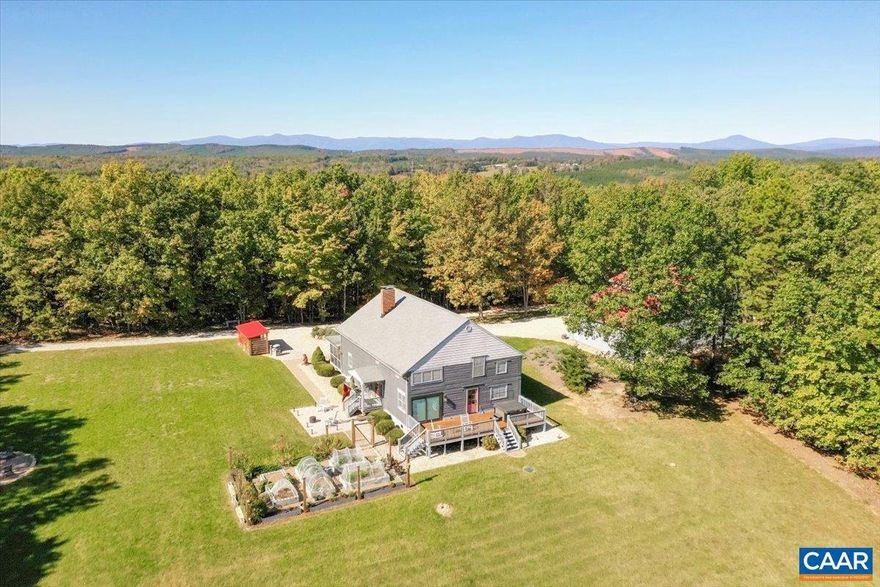 County Retreat on 33 Acres! Stylish Log Home with a fabulous Barn and Workshop only 20 minutes from Town. You will love the updated kitchen with custom cabinetry, quartz countertops, stainless steel appliances and a wood cook stove with an oven which adds to the log cabin charm. Spacious dining and living rooms both with direct access to outdoor living on porches and decks. You can live on one level and let your guests use the second floor. Main level includes a primary suite with adjacent laundry closet and a half bath. On the second level you will find 3 bedrooms, a full bath and an office plus two loft areas. Wood floors throughout, fireplace in the living room and lots of storage here! Outdoor living is well planned with patios, screened porch and deck, hot tub, raised beds, fire pit, wood shed and ample parking. Large workshop with elec and water and attached barn with a second floor. Come to the country for Gorgeous Sunsets & Stargazing! 15 min to the James River State Park!,Painted Cabinets,Quartz Counter,Wood Cabinets,Fireplace in Kitchen,Fireplace in Living Room