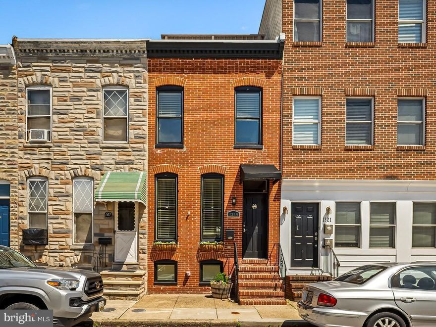 OPEN SATURDAY 12-2!  
Welcome to 1319 Clarkson Street—where classic Federal Hill charm meets the lifestyle today’s buyers are chasing. This stylish 3 bedroom, 3 full bath brick rowhome delivers the perfect blend of character, comfort, and city convenience, all tucked on a quiet street just moments from the energy of the neighborhood.
Step inside to find a warm, surprisingly wide and deep inviting main level with an easy, open flow—ideal for both everyday living and entertaining. Exposed brick, brand new solid hardwood floors, wide staircases and thoughtfully updated finishes create a space that feels timeless and fresh. The kitchen is well-appointed with modern white cabinetry, ample granite counter space, stainless steel appliances and plenty of room for the island and eat-in area.  
Upstairs you’ll find two sizable bedrooms and updated baths as well as a laundry closet in the hallway.  Natural light pours in, giving each room a bright, airy feel. The finished lower level offers a 3rd bedroom/guest suite or family room area, a full bath and additional storage.  
But the real showstopper? The rooftop deck. Just off the bedroom you’ll find a lovely terrace, and then head up top and take in sweeping city views—perfect for morning coffee, sunset cocktails, or hosting friends before a night out. This is the kind of outdoor space that truly elevates city living.
In a neighborhood where parking is at a premium, the rear parking pad is a game-changer—offering convenience and peace of mind.
Recent updates include, but aren’t limited to: recoated roof (2026), freshly stained deck (2026), some freshly painted rooms (2026), replaced hardwood flooring on the main level (2026), newly serviced HVAC systems and so much more. This home is practical and turn key!
Incredible access to community parks, dining, markets, Camden Yards, M&T Bank Stadium and easy connections to I-95 and points south.