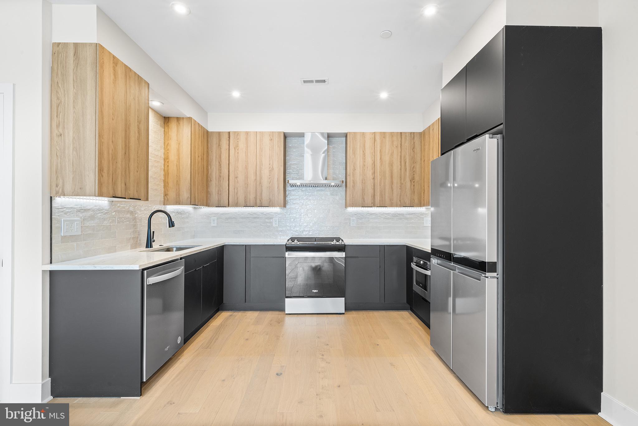 Welcome to this brand-new, bi-level 2-bedroom, 2.5-bathroom unit offering 1,150 square feet of modern elegance in the heart of Olde Kensington! Featuring solid hardwood floors, a sleek kitchen with modern flat-panel cabinetry and stainless steel appliances, and a convenient in-unit washer and dryer, this unit is designed for both style and comfort. Each bedroom boasts its own private ensuite bathroom, while a powder room on the main level adds extra convenience. Enjoy your own outdoor space, perfect for unwinding or entertaining, and live just blocks from Front Street and Frankford Ave, surrounded by some of the city’s best dining and amenities. First, last, and security due at signing. Pets considered at landlord’s discretion.
Brand New Construction, Bi-Level 2 Bedroom, 2.5 Bathroom, 1,150 Square-Foot Unit in the heart of Olde Kensington. Unit features solid hardwood floors, a modern kitchen with flat panel cabinets, stainless steel appliances, in unit washer and dryer and rear outdoor space. Each bedroom features it's own private ensuite bathroom and a powder room on the main level. Few blocks from Front Street and Frankford Ave. First, Last & Security due at signing. Pets decided by landlord.