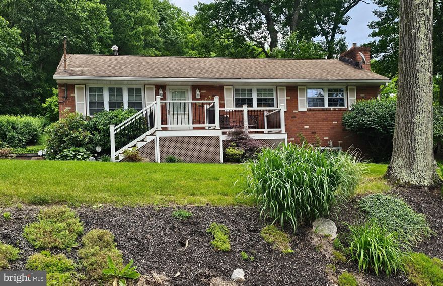 THIS 3 BEDROOM IS READY TO MOVE RIGHT IN.  MAIN FLOOR FEATURES HARDWOOD FLOORS AND 3 BEDROOMS AND REMODELED BATH. BASEMENT LEVEL HAS A FAMILY ROOM WITH NEW CARPET INSTALLED 9/23/2024, A REMODLED BATH AND LAUNDRY ROOM. ONE CAR GARAGE AND AN ADDITIONAL LONG DRIVEWAY IN REAR OF HOUSE AND EXTENSIVE LANDSCAPING.  GO OUT THROUGH THE BRAND NEW SLIDING GLASS DOORS TO A LARGE DECK FOR ENTERTAINING OR RELAXING.