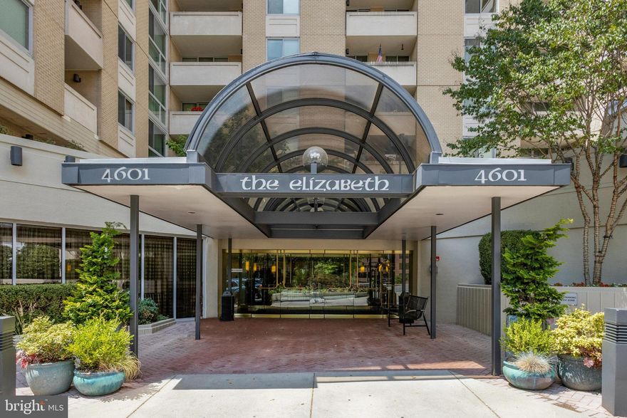 Breathtaking views and walkable lifestyle in the heart of Chevy Chase/Friendship Heights. Welcome to a rarely available and highly desirable floor plan at The Elizabeth, with over 1500 square feet of light-filled living spaces, a balcony, and southern and northern exposures. This updated penthouse residence has an open-plan double living room and large dining area, with a wide and beautiful window overlooking the treetops. The  spacious, semi-open kitchen keeps you connected to the entertaining areas, while receiving plenty of natural light. The adjacent den and powder room are perfect for home-office or other uses. To the south are two spacious bedrooms with glass doors leading to the shared balcony. Beautiful bathrooms, wood floors, ample closets, in-unit washer/dryer, stainless steel appliances, and an underground garage parking make this home a delight. The Elizabeth is pet-friendly and has plenty of garage parking for guests. Residents enjoy beautiful common areas and excellent amenities, including a 24-hour desk, indoor pool, gym, library, party room and patio.  A small market and other service outlets are connected to the building. A free neighborhood shuttle service or a short walk leads to the Friendship Heights Metro, a community center, Whole Foods, Saks Fifth Ave, Bloomingdales, and numerous dining options such as Clyde's or The Junction,. All utilities and amenities are included in the monthly fee, with the exception of Internet/cable service.