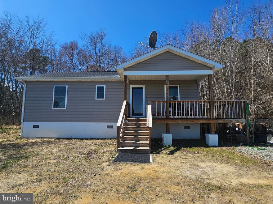 THIS PROPERTY IS BACK ON THE MARKET THROUGH ABSOLUTELY NO FAULT OF THE SELLER!!!  Be sure to put this cute 2BR, 1 BA bungalow on your home tour!  On the outskirts of Princess Anne in the peaceful, serene countryside, privacy is sure to prevail.  Great room concept for living, dining, kitchen area;  generous size bedrooms;  front porch is functional as well as attractive, and wraps around to a sturdy ramp which makes access easy for ALL.  Septic is a holding tank... current owner has it pumped out every 4 months.