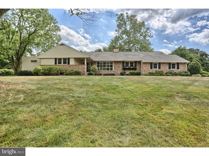 Spaciousness is the theme in this picturesque home which is nestled in an enclave of 8 custom built homes. This is amongst some of the finest real estate Pottsgrove has to offer. Built in 1952 by local builder Al Kutz, this home has gone under complete renovation in 2016, giving new life to this lovely home.  Situated on almost   of an acre, the grounds are sure to impress. This home has been meticulously maintained landscaping, a charming front porch and a solid stone facade.  As you enter the home you will be greeted by an open foyer and living room with large picture window. Expresso floors, LED lighting and grey color tones are featured throughout the home. Around the corner is a spacious family room with a stone fireplace and custom built-ins flanking one side and picture windows and French doors on the other. The open floor plan continues into the kitchen where there is eat-in dining and a newly remodeled kitchen. The kitchen features white cabinets with granite countertops and stainless steel appliances with a wine/beverage cooler.  Off the kitchen is a butler's pantry with custom built-ins on one side and laundry room on the other side with plenty of storage. On the other wing of the home are bedrooms and where your dream master awaits. The bedroom has plenty of room for a king size bed and sitting area. The master also has his and hers closets with an additional cedar closet. Completing this living space is a bathroom with walk in shower with nice title accents and glass surround and double vanity and stone counters.  Also on the first floor is an additional two bedrooms and a full bath and upstairs is a bedroom with a small full bath. Outside is a large covered patio, great for those hot summer days with access to an attached two car garage. In addition to the impressive features this home has to offer, the location cannot be beat, close to Brookside Country Club, The Hill School, Wyndcroft School, and Pottstown Hospital.  Come take a tour and see what this well constructed home has to offer.