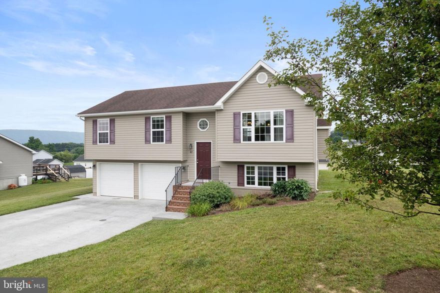 82 Silver Ct. encompasses everything a family home should be. Sitting on 0.34 level acres just outside of Maurertown in the Madison Estates subdivision. Offering 1,649 sq ft of living space, 4 bedrooms, 2.5 bathrooms, this house is perfectly designed to accommodate a growing family. The upper level features a modern open concept living area and vaulted ceilings, while the hardwood floors and gas fireplace adds a classic touch of warmth and welcoming. The open, bright design of the main living area beckons for large gatherings of friends and family. The easy flow of the kitchen is enhanced by center island with breakfast bar and creates a natural separation into the dining area and living room while still holding on to the open airy feeling of the area. Just off the dining area the sliding glass doors lead to the freshly stained deck, which is perfect for summertime dinners, cookouts, or just enjoying the magnificent mountain views. The upper level also offers a primary bedroom with large closet and ensuite bathroom, a full hall bath, and 2 additional bedrooms. Head downstairs for even more living space with additional living room area which could also function as an office, entertainment room, game room, or playroom. The 4th bedroom and a half bath along with a laundry area and access to the 2-car garage complete this home. If 82 Silver Ct. sounds like your idea of home, schedule your showing today!