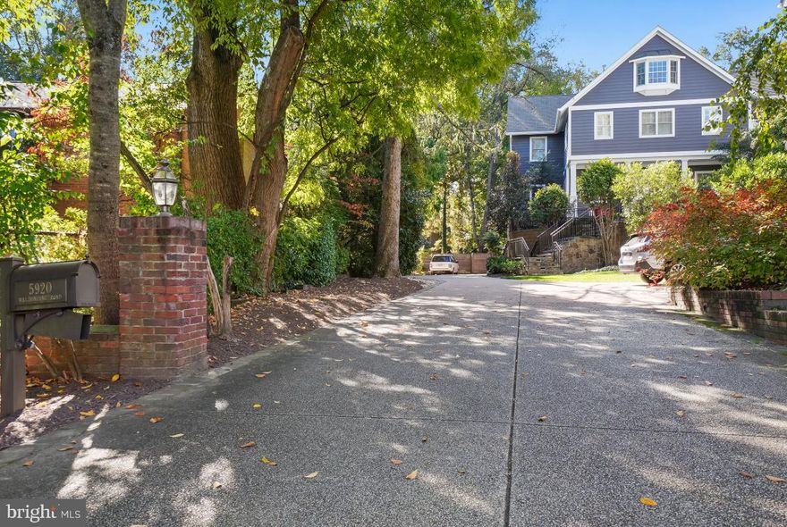 Beautifully sited on a sprawling 15,347 square feet lot in Glen Mark Park, this custom-built home was completed in 2007 with much collaboration with the homeowners. 
6,487 +/- square feet of living space, 3-zone HVAC systems and an elevator.  It’s the perfectly-sized home with a beautiful landscaping, 3 patios, 2-car garage and space for 2 more cars in driveway.  Patio in front of home has a beautiful fountain, and the flow from this patio to the mostly-level yard were designed with large outdoor entertaining in mind. 
Terrific floor plan with generous room sizes and finer details, including oversized windows and hardwood floors.   With a flagstone walkway and covered front porch, step into the foyer with high ceilings and an air of elegance. The main level of this home enjoys a formal living room, home office, elevator to all levels of the home, sun-drenched family room with fireplace, powder room, kitchen open to the family room and an eat-in breakfast nook overlooking the back yard and patio.  There is also a formal dining room for elegant occasions.  The kitchen is a culinary asset for all types of entertaining, while the adjacent flagstone patio provides a serene spot for alfresco dining and relaxation. 
The second level features four bedrooms, three full bathrooms and laundry room. Retreat into the primary suite, adorned with a reading room and fireplace, walk-in closet and a luxurious en-suite bathroom with a fireplace.  
The third floor has spacious den or office, exercise room or bedroom and a full bath with a steam feature.  
The lower level has a home theater with mini-bar & undercounter refrigerator, full bath with a roll-in shower for accessibility, another home office and bedroom.  2-car garage with EV charger. The lower level provides versatile living options for guests or extended family members.  
Just a short stroll to the natural beauty of the Potomac River, as well as the arts and culture of Glen Echo Park. Conveniently located near downtown Bethesda, Friendship Heights, DC and major commuting routes, this property is a supreme location close to everything while providing a secluded retreat. 

Kitchen:  Wolf 6-burner natural gas range top; Wolf wall oven under counter; microwave under counter; two Miele dishwashers; Sub-Zero undercounter refrigerator;  Sub-Zero refrigerator; and in-cabinet Miele espresso maker with warmer drawer beneath.
3rd floor (top floor):  Shower is equipped with Steamist steam shower.  Two of the closets are lined with cedar.
Lower level:  Full bath designed for persons using a wheelchair.  Roll-in shower, space under sink top and ample floor space to maneuver.
Theater room has a wet bar with undercounter refrigerator.
Elevator serves all 4 levels of the home.  It is hydraulic for smooth operation, much like what you see in commercial office buildings.
The home's exterior and landscaping has professionally designed lighting, which comes on automatically at dusk.