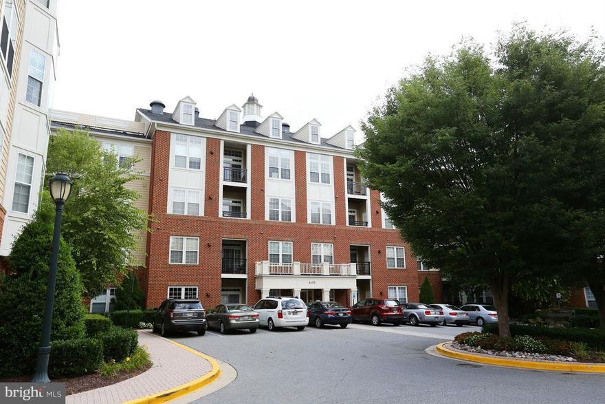 Top floor with open floor plan w/2 BR on opposite sides of the unit, 2BA , living room w/gas fireplace,large den,gourmet kitchen.This home is in a fantastic location w./ easy access  to Metro, 1-270, shopping, dining and more. 2 balconies w/view of trees  11 parking spaces reserved for 9405 on the lot to left