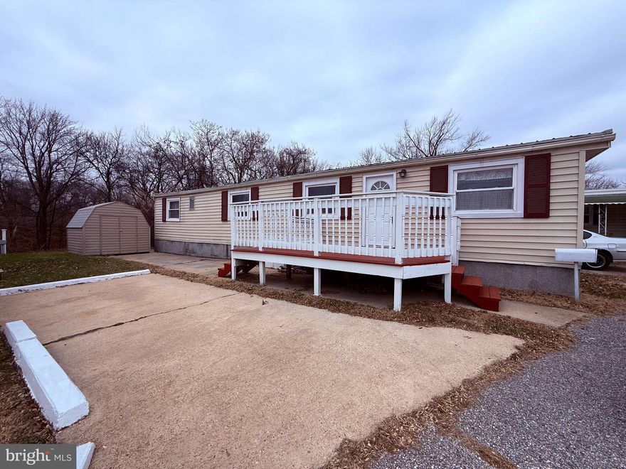 2 Bedroom, 1 Bath Mobile home Liberty Mobile Home Park.  Home has side deck/porch and a parking pad.  It backs to the woods for privacy.  Eat in kitchen includes refrigerator, gas stove and microwave.  Washer & dryer are included.  Home needs some updates and a few repairs.  Sold AS IS.  Ground rent is $800/month.  Park approval required.