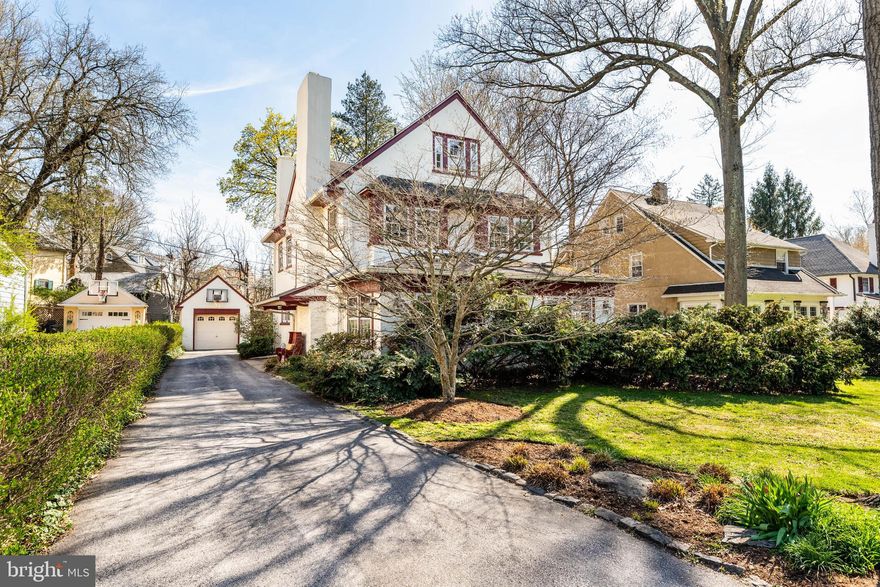 Welcome to 420 Sycamore Ave, a charming 5 bedroom, 3.5 bath Dutch Colonial tucked on a picturesque street in the heart of Lower Merion, walkable to the train in Merion Station as well as Narberth shops and restaurants.  Character abounds in this impeccably maintained 3 story home, cherished and thoughtfully updated by its current owners of almost 40 years.  Enter through the bright foyer, inviting you into the home and leading to a spacious formal living room with stone fireplace, crown molding and two sets of French doors opening into the renovated family room/sun room with custom built-in shelving.  The first floor has hardwood floors throughout, and a highlight is the dining room with wainscoting, crown molding and large windows with colonial revival trim.  At the heart of the home is the gourmet kitchen, which has been designed with every day living in mind, featuring granite countertops, wood cabinetry and a large center island with seating.  Off the kitchen is a powder room as well as a butler's pantry/wet bar, providing direct access to a cedar deck perfect for al fresco dining, family gatherings or summer grilling.  A flat rear yard provides ample space for a play area, pets, gardening and entertaining.  Ascend the beautiful staircase, past the large palladium window where you'll find a tastefully updated hall bathroom and 3 bedrooms, including the primary bedroom with attached ensuite bathroom and office area/potential walk-in closet. Completing the 2nd floor is a sunny laundry room.  Upstairs on the 3rd floor are 2 additional bedrooms (or flexible spaces for guest, office or playroom) and a third updated full bathroom. The large unfinished basement with built-in shelves is perfect for storage, as well as the 1 car detached garage.  This gracious residence blends timeless architectural character with thoughtful updates, generous living spaces and a tree-lined walkable neighborhood with sidewalks. It offers the perfect blend of suburban tranquility and urban accessibility on top of the award-winning Lower Merion school district and all that Philadelphia's Main Line has to offer!