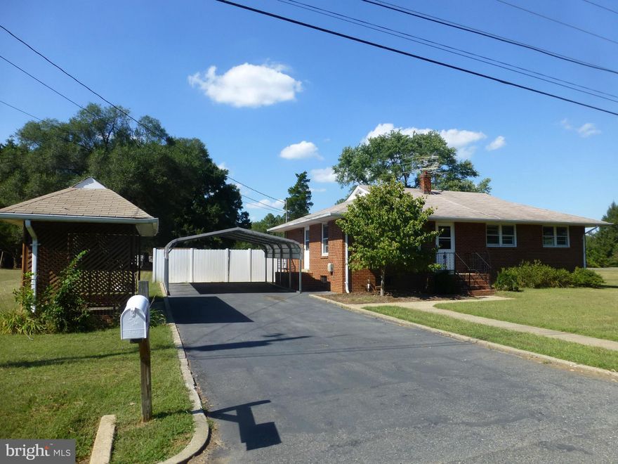 Solid Brick Rambler...Oversize Carport and Covered Storage Area....Hardwoods Main Level in Living and all Bedrooms...Nice Deck at Rear of Home.  Fenced Yard on Large Site (all of lot is not fenced)...Storage Shed at rear of lot...Owner Providing One Year Warranty for Buyer..Close to Downtown Fredericksburg and all you need.
