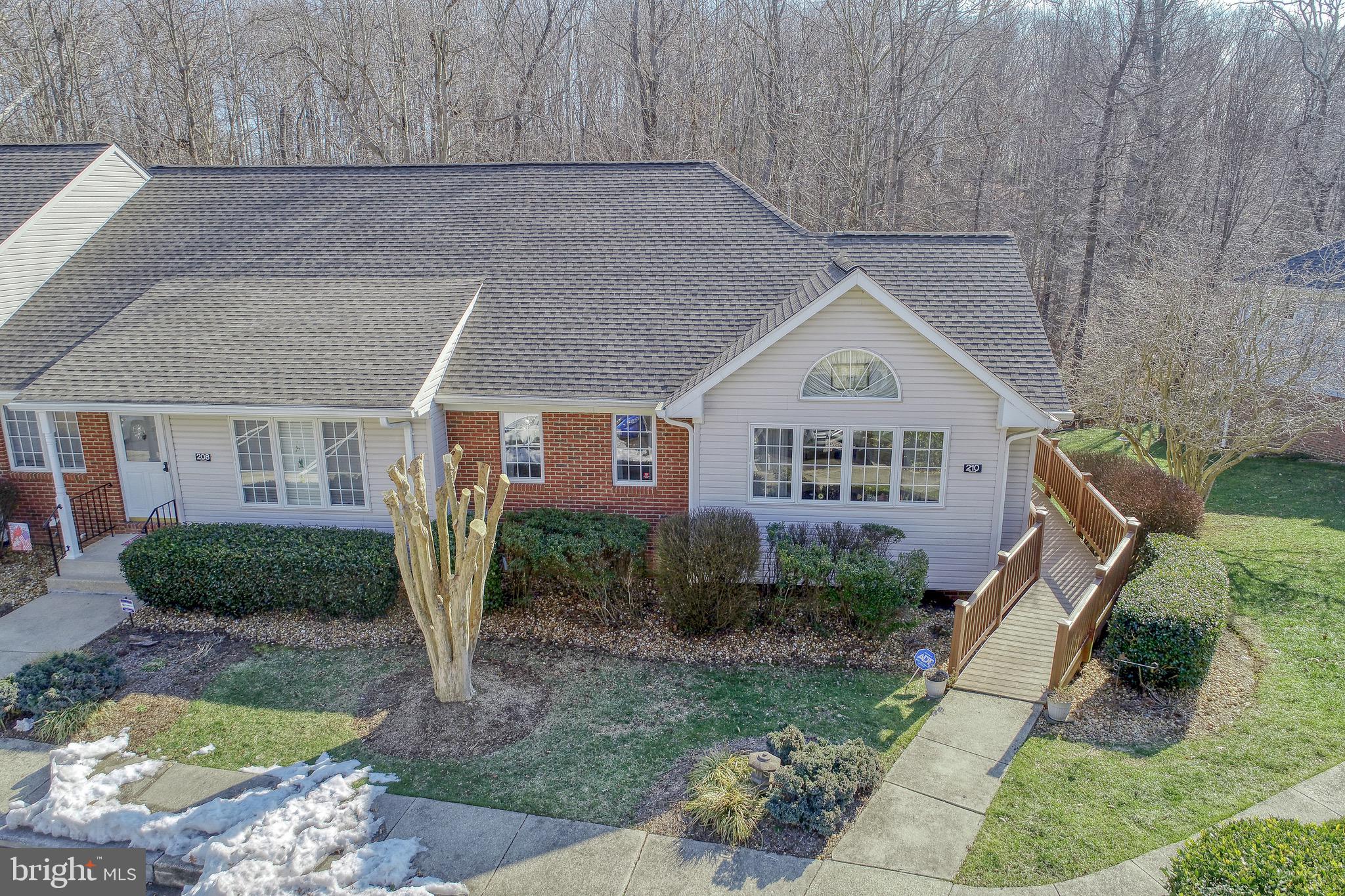 Coming Soon. This is an awesome opportunity to own a beautiful, move-in ready home, in a great location! This attached rambler floor plan sets on a full basement and offers easy living with peace of mind - the condo association provides exterior building maintenance, lawn care, trash removal, snow removal, road maintenance, and more! This beautiful home offers an open layout, with a bright and spacious living room, dining room and galley style kitchen with ample cabinetry and recently replaced stainless steel appliances! There are 2 large bedrooms on the main level and 2 full baths. There is a maintenance free deck off the back of the house that looks out to a beautiful wooded view! Downstairs, you will enjoy the spacious rec room and an adjoining finished room, currently used as an office, that can be easily converted to a 3rd bedroom, if needed. The downstairs also features a full bath, a workshop and a large storage area. The downstairs is bright, with full sized windows and a walkout, below the upper deck. This level walks out to a very nice private patio space. This home is affordably priced, move in ready and located close to shopping, restaurants and entertainment. Enjoy easy living in this charming and well maintained home!