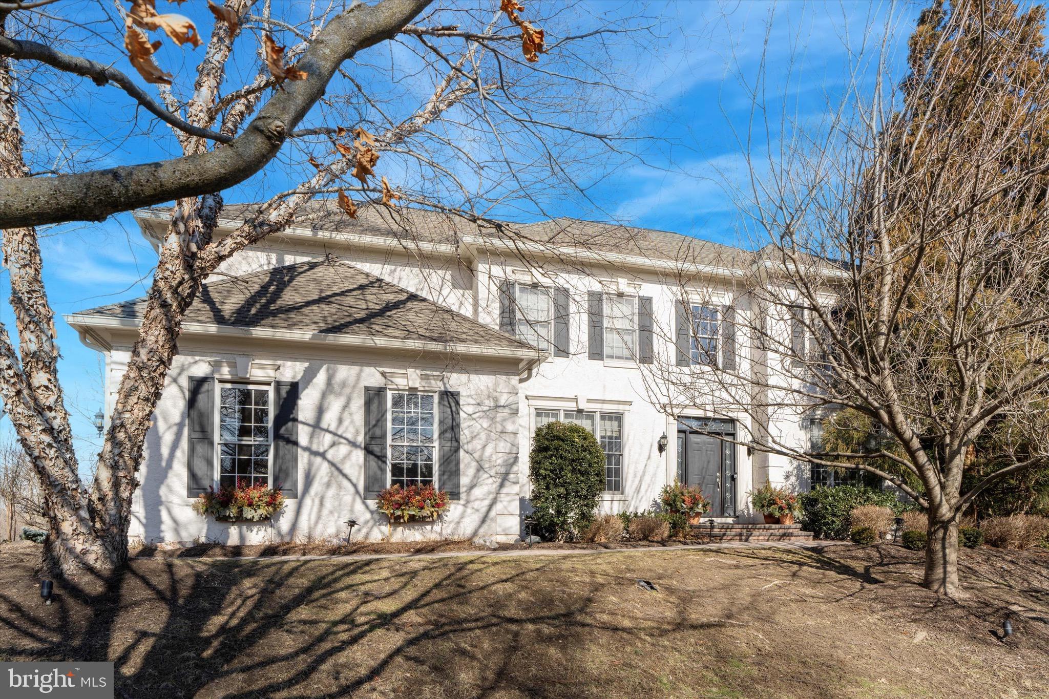 This stately home is situated on a sizable corner lot, in the sought-after community of ‘Reserve at Lafayette Hill’. With over 4,500+ Square Feet of living space, this home has more than enough space for your family, and an incredibly flexible floorplan to suit your individual needs. Boasting a one-of-a-kind layout in this community, you will find 5 bedrooms each with their own personal bathroom! Thoughtfully updated and lovingly maintained throughout ownership, you’ll appreciate the attention to every design detail. A stunning 2-story foyer welcomes you, and you’ll immediately notice the diagonally laid hardwood flooring throughout. The family room shines with a 2-story fireplace, corner windows for tons of natural light, and a stylish curved balcony above. The chef will never feel left out with this open floor plan. The kitchen was professionally designed and updated with timeless features, including a gas cooking range with custom hood, a large pantry, and an island that could easily become the heart of the home. Step outside to the completely private paver patio, a fun environment to entertain family & friends in the upcoming warmer months. The main floor also features a formal dining room, living room, office with beautiful wood built-ins, mudroom, and half bath. Head upstairs to find the well appointed Owner’s Suite, including a sprawling bathroom and walk-in closet. The bathroom features doubles sinks and a separate vanity area, situated in front of a window for perfect lighting. There are 3 more bedrooms, each with their own full bathroom, and a convenient 2nd floor laundry area. Still looking for more space? The finished basement is impressive at 1,330 square feet and includes a living/entertainment room, wraparound bar with kitchenette, game room, gym, and another bedroom + full bath. A pristine garage has shiplap wall storage, and resilient floor tiles. The roof is 8 years young, and the 2-zone HVAC system was installed in 2015 and serviced in 2024. Being a corner lot, there is a spacious wraparound yard, most of which is fenced. The mature landscaping creates a great sense of privacy. Don’t forget to check out the floorplans at the end of the photos, so you can truly see all of the amazing space this home has to offer! Imagine, having your own estate home in Lafayette Hill with more than enough space for your family, and every amenity you could want!