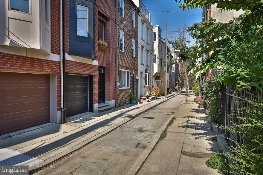 Welcome to 1706 Rodman a well kept 3 bedroom + flex room,  2.5 bath home located smack between the most desirable neighborhoods of Rittenhouse Square and Graduate Hospital.  Add 1-CAR attached garage and you're HOME!   Rodman Street is tree lined and has a wonderful neighborhood feel, albeit steps away from the cafes, restaurants and markets of Rittenhouse Square. This 4-level home has all the features you could be seeking including hardwood floors throughout, central air, a rear yard, roof deck, balcony, 3 full bedrooms and your very own parking. The first floor features a nicely sized flex room/den/bedroom, a powder room and access to the private garage. The 2nd/main floor has an open floorplan that flows from living room, to the dining area into the fully equipped kitchen. Off the living room is a glass sliding door that leads to the private rear patio.  The third floor has two generously sized bedrooms with great closet space, a full bathroom and a conveniently located laundry room. The top floor reveals the master ensuite bedroom, with vaulted ceilings and access to your private deck, boasting city skyline views. Last, but not least you can take advantage of the private garden right across the street that only 5 other neighbors can access! Pets MAY be acceptable on a case-by-case basis. $1000 pet deposit required, if pet is accepted.