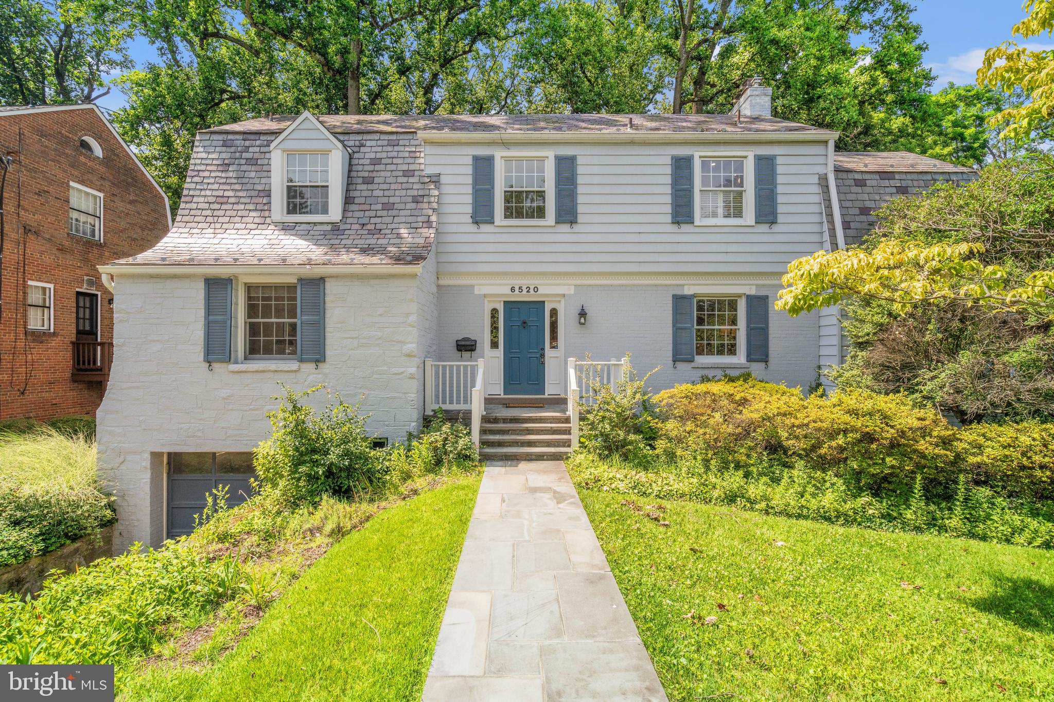 Rarely does a house come on the market in Chevy Chase that combines an uber-convenient location, ample living space and a huge lot. 6520 Western Avenue is just such a property, boasting 5 bedrooms, 3.5 bathrooms and a 17,422 square foot lot. Located on the quiet end of Western Avenue far from the traffic closer to Chevy Chase Circle, this placid location is a short distance from all of the amenities of Rock Creek Park, including walking and bike paths, tennis courts, basketball courts, open fields for baseball, soccer and football, Candy Cane City, the historic, premier playground in Chevy Chase and Meadowbrook Stables. The shopping and dining amenities along upper Connecticut Avenue are very close, as are the shops, services, dining and farm market along Brookville Road. Combine this with an easy commute to downtown Washington or Bethesda, and one will find that this location represents the height of convenience.
The property itself combines the charm and craftsmanship found in a house built in 1939, often considered an era representing the pinnacle of sturdy quality (when builders included newer technologies prior to the shortages faced during World War II) with modern amenities like the fabulous kitchen, primary bathroom and amazing walk-in closet in the primary suite. The floor plan is conducive to relaxed, functional living, yet it’s perfect for entertaining, with large public rooms and an easy flow to the back deck overlooking the expansive, fenced backyard on this huge, .4-acre lot. Every day, one will be comforted by peaceful surroundings, including loads of natural sunlight, hardwood floors, arched doorways, built-ins, privacy and beautiful landscaping.
The highly rated public schools and the proximity to an array of private schools bring an added layer of enduring value to this property, and 6520 Western Avenue will be a place where lifelong memories will be made.