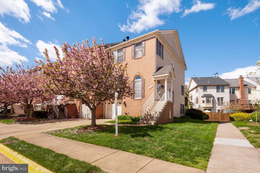 Welcome to 14747 Winterfield Court, a stunning end-unit brick townhome in the sought-after Sully Station II neighborhood. This beautifully updated home offers three bedrooms, 2.55 baths, and three finished levels, featuring a light-filled open floor plan. The renovated kitchen boasts quartz countertops, stainless steel appliances, a five-burner gas cooktop, a wall oven, custom cabinetry with soft-close drawers, breakfast bar with pendant lighting, and eat-in area with bay window. Enjoy hardwood floors throughout the main level, a cozy three-sided wood-burning fireplace, and a spacious dining area with elegant crown molding and French doors leading to the relaxing back deck overlooking common area.  The primary suite impresses with a vaulted ceiling, walk-in closet, and a spa-like bath featuring a jetted soaking tub, dual vanity, and separate shower. The walk-out lower level offers a large family room, wood-burning fireplace, recessed lighting, an additional powder room, and a walk-out leading to the serene outdoor space. Additional highlights include a new Trane HVAC system (2021) with a UV light air scrubber, a new gas water heater (2013), fresh paint throughout, and new carpet on the upper level and staircase. Residents enjoy top-tier community amenities, including an Olympic-size swimming pool, tennis and multipurpose courts, scenic walking trails, and year-round events. Conveniently located near shopping, dining, parks, Dulles Airport, and I-66, this home is a must-see!