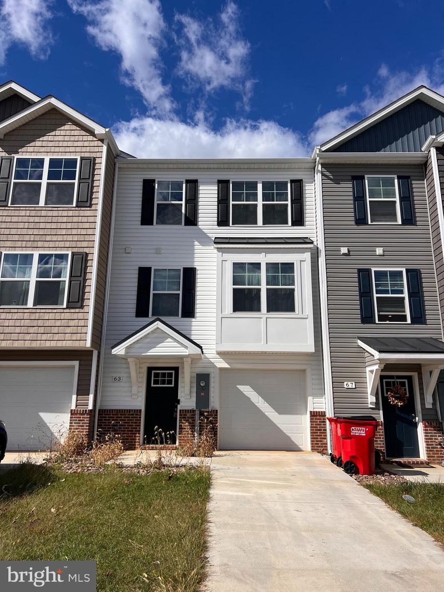 A beautiful town home for rent located in Martinsburg, WV!  Built in 2024 and features stainless steel appliances, beautiful flooring throughout and carpeted bedrooms.  Has a very spacious layout and also includes a decent sized backyard, backing up to woods.  Has a one car garage with a bedroom area\ study on the main floor as well. Must make at least $6,000 a month to qualify and no pets allowed at this time.