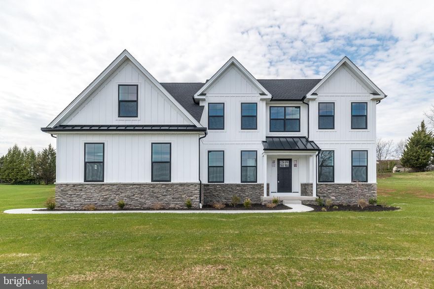 Looking for privacy and convenience all in a Brand New Custom Build Home ready for immediate occupancy.  No Homeowner's Association Fees! Enter in to the open foyer accented by the grand turned staircase with custom wood treads and black accent balusters. This home has an traditional open concept style floorplan.  The private first floor office has paneled double door offering a quiet setting and privacy.  Kitchen offers custom maple cabinetry features 48-inch wall cabinets, complemented by quartz countertops and a  large kitchen island with space for four (4) kitchen stools.  The kitchen has high hat lighting and multiple pendant accent lighting over the island and kitchen sink. The kitchen offers a large triple window overlooking the rear yard with a deep bowl sink with a single-lever pullout faucet and garbage disposal.  Quality GE Profile appliances including exterior exhaust hood, double wall oven, dishwasher and refrigerator. There is an under cabinet microwave oven and a wine cabinet refrigerator.  All stainless steel appliances. Also, a 5 burner gas cooktop and subway ceramic tile backsplash.   There is a separate breakfast room which is bright and sunny, the breakfast room has a chandelier and  looks out over the sliding glass doors to the back yard.  There is a butlers pantry with upper and lower cabinetry and quartz counter tops and an oversized pantry with shelving.  The large dining room has a chandelier and a custom tray ceiling. The family room adjoins the kitchen and breakfast room in to a huge open lifestyle family living space.  The family room fireplace is stone, floor to ceiling with stone hearth propane fireplace with wood mantle and a lighted ceiling fan. The powder room has a pedestal sink and upgraded fixtures.  The master bedroom is a very special place. Offering cathedral ceilings, a lighted ceiling fan, custom walk in closet and luxurious private bath, with it's double sink, custom oversized maple vanity, oversized natural Carrara Marble shower with frameless glass and 'rainmaker' showerhead with adjustable wand,  a free standing solid surface tub, private toilet room, and spacious linen closet. Flooring for the entire main bath is oversized format ceramic tile.  There are three additional generously sized bedrooms.  The hall bath also has double sinks and a separate 'water closet', split bathroom.  An additional bedroom offers the third (3rd) full bath, 'En Suite'.  All bedrooms and closets offer neutral carpeting.  The first floor features nine-foot ceilings and wide plank engineered oak hardwood flooring throughout which  continues into the second floor hallway and in the second floor laundry. Interior doors are 3-panel style with upgraded matte black lever hardware.  The hall bath features a full size tub with tiled walls, while the private bath includes a walk in shower with ceramic tile walls. Both are appointed with Moen Gibson matte black faucets, custom vanities with solid surface tops, oversized mirrors, and ceramic tile floors. The home features architectural roof shingles and a combination of stone with vertical and horizontal vinyl siding, supported by 2×6 exterior wall construction. Maintenance-free vinyl windows come with interior wood jambs, screens, and grids.  The front entry is finished with an insulated fiberglass raised-panel door. The garage is equipped with steel raised-panel doors and garage door openers and a separate man door. Exterior details include aluminum gutters, downspouts, and fascia, along with vinyl soffits and a ridge vent attic ventilation system. The property sits on a  One (1) acre lot with an asphalt driveway, a radius front walkway, and a professionally seeded lawn, with landscaping,  plus two exterior hose connections and two exterior outlets. The basement is built with 9-foot high clearance.  Close proximity to major highways,  excellent dining and night LIFE entertainment in the heart of nearby Phoenixville.