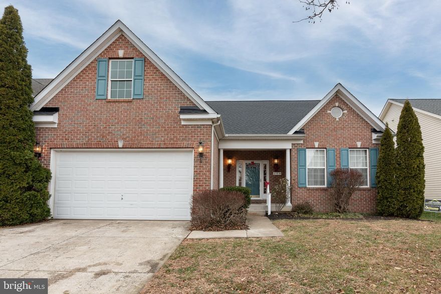 Former Builders Models Home with Many Upgrades!! Brand New Roof in December 2025!! Tray ceilings, crown molding, chair railings,  9 foot ceilings, an office/library, recessed lighting, hardwood floors and more.  This 3 bedroom with 2 and 1/2 bathroom home provides generous living space and a comfortable layout. The updated kitchen with granite counter tops, and 42' cabinets, leads into a bright sunroom/breakfast room with large windows overlooking the spacious back yard. The beautiful hardwood flooring carries throughout the foyer, office/ sitting room, the large dining room and family room which features a fireplace with glass doors and screen. The main floor primary bedroom suite with hardwood flooring offers a full bathroom with double vanities, a soaking tub, shower and a walk-in closet. The second floor includes 2 bedrooms, a rec room and a full bathroom. There is a 2 car garage with built-in storage. Conveniently located across the street from the George Murphy community pool, schools, hospitals and the Easton Point Marina.