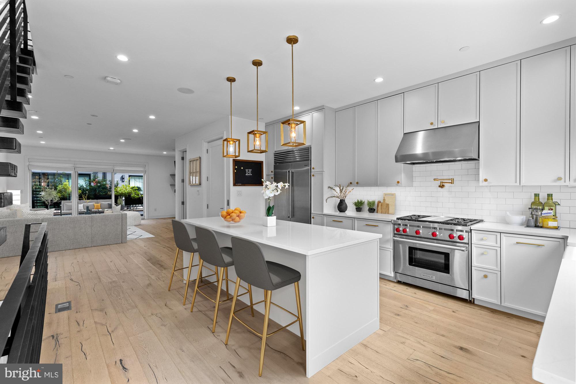 Luxury city living at its best in this gated townhome community. This 4200 sq ft open floor plan with an abundance of natural light, fireplace, and 2 car garage that has 5 years left on the tax abatement is a must-see! Wide plank floors are throughout, a chef's kitchen with a Wolf stove and cooktop, a Sub Zero refrigerator, and an island workspace. All bedrooms have walk-in closets with custom shelving. The owner's suite and designer bathroom with a soaking tub is total relaxation. Plenty of entertainment spaces with either the 1st floor deck or the rooftop deck with a half bath and wet bar. Owners upgraded and replaced the decking and the rear sliders and windows. There is a 3rd option too! The basement is currently being used as a movie room and the big screen and projector are included! Kater Court has a walking score of 10 to the Avenue of the Arts, restaurants, and shopping while also conveniently located to major highways and shore points. Pack your bags!