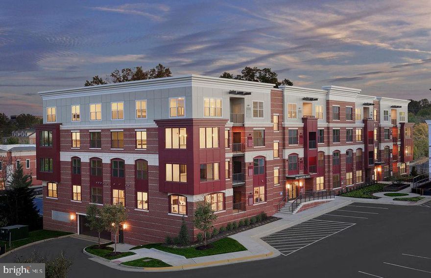 NEW TO THE MARKET !  This condo is GORGEOUS and includes many upgrades!   Amazing open floor plan with two-bedroom, two bath, PLUS DEN.   Shaw 5 "manufactured hardwood flooring in living areas and Shaw upgraded carpet and pad in bedrooms.  STUNNING!   Shows like a brand new model!  Luxury living in Fairfax City in this lovely 4 story elevator building with garage parking and secure entry vestibule.  CONVENIENT TO EVERYTHING YOU NEED!  Great walkable location near shopping, restaurants and Old Town Fairfax.  Freshly painted, professionally cleaned and ready for you to call home.  Upgraded gourmet KitchenAid Stainless Steel Appliance Package.  Quartz countertops and upgraded white linen cabinetry in kitchen and bathrooms.  Subway tile backsplash and under cabinet lighting in the kitchen.  Ceiling recessed LED lighting and fan pre-wired.  Living room with sliding glass door to private covered balcony perfect for relaxing within a tree lined backyard.  Storage closet off balcony with tankless hot water heater.  Gas heat, gas hot water and gas stove for gourmet cooking.  Bedrooms have large windows and comfortable floor space (Master 12' x 18' and second 12' by 11').  Luxury master bathroom with upgraded ceramic floor tile, quartz countertops with double undermount sinks, subway tile to ceiling in extra large frameless glass shower with built in seat. Extra large 12' by 7' walk in closet with double rack hanging space.  Second bathroom has subway tile within the bathtub shower combo.  Full size front load Whirlpool washer and dryer in foyer closet and separate coat closet.  13' x 9' den makes a  super office.  One assigned parking space in garage with additional open parking around the atrium on Norton Place.  Bicycle racks available to secure bikes in the garage and next to the building.  Don't miss this gorgeous move-in ready condo!   Close to shopping and restaurants in Fairfax City,  Fair Oaks Mall and Fairfax Corner.  Public bus stop right next to the building.  Easy access to I-66, I-495, Metro,  Fairfax Commuter and free Park and Ride.  CONVENIENCE!