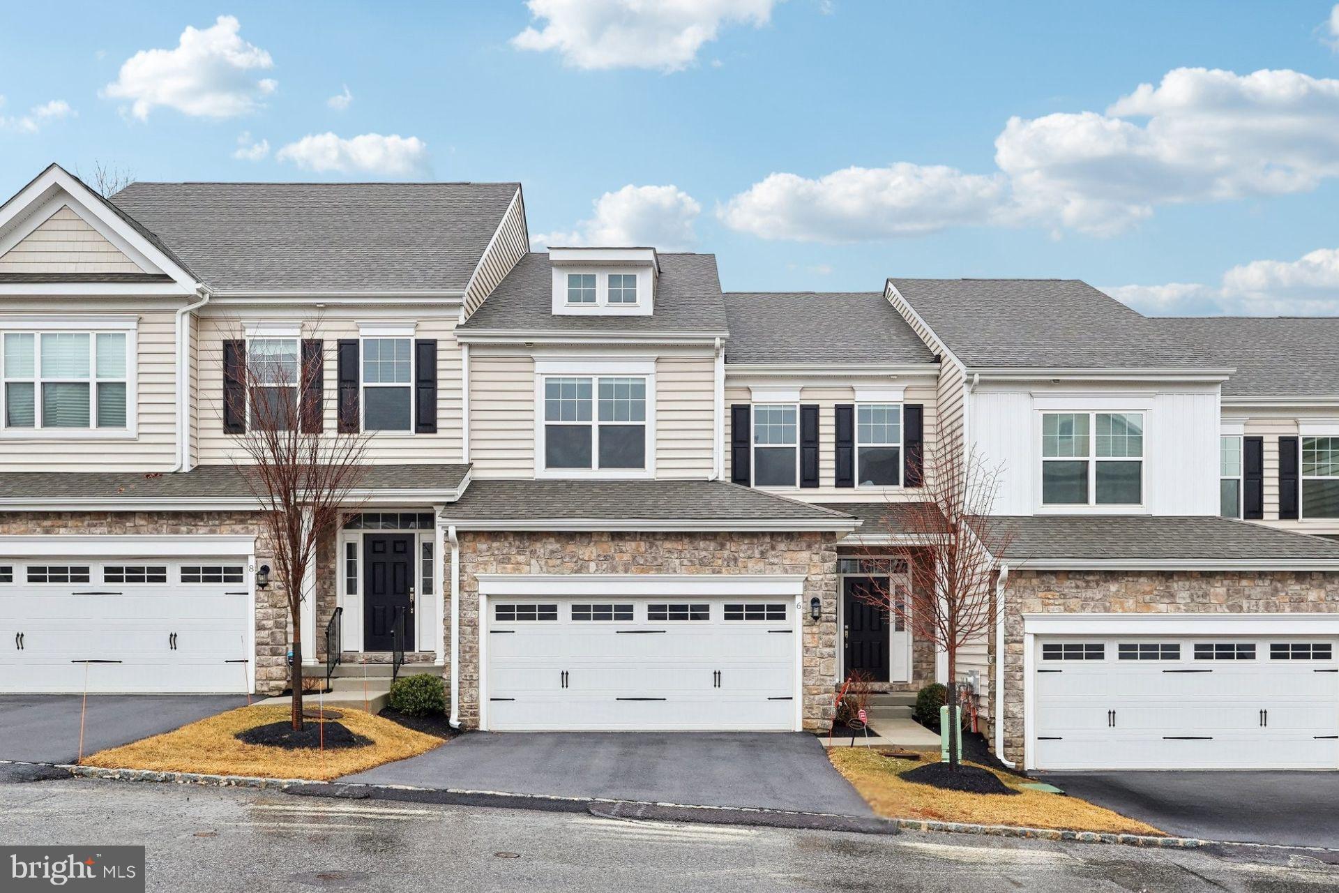 Price reduction!! Why wait to build when you can own a like-new home with exceptional upgrades? Welcome to 6 Skydance Way, a stunning 3-year-young townhome in the sought-after Willistown Point community. With over $40,000 in post construction upgrades, this 3-bedroom, 3.5-bath residence offers flooring, lighting, and window treatment upgrades as well as professional paint throughout.
Step inside the inviting foyer, where you'll immediately notice a private home office with French doors—a rare and valuable feature for this model. The open-concept main level is an entertainer’s dream, boasting a bright and airy layout with recessed lighting throughout. The gourmet kitchen is a showstopper, featuring quartz countertops, crisp white cabinetry, an upgraded stylish tile backsplash, and a spacious seated island accented by pendant lighting. Enjoy top-tier stainless steel appliances, a gas cooktop, and a generous pantry for all your storage needs.
The dining area is bathed in natural light from sliding doors that lead to a charming paver patio with a gas line installed, perfect for outdoor gatherings. Cozy up in the living room by the gas fireplace, creating a warm and inviting ambiance. A powder room with upgraded vanity and access to the two-car garage complete this level.
Upstairs, french doors welcome you into the luxurious primary suite, highlighted by a tray ceiling, spacious closet, and an ensuite bath featuring a glass-enclosed shower and dual vanities. Two additional well-sized bedrooms share a beautifully appointed hall bath, and the convenient second-floor laundry adds ease to your daily routine.
The finished basement expands your living space, offering flexibility for a media room, home gym, or additional guest suite.
Nestled in the Great Valley School District, this home provides effortless access to shopping, dining, and major roadways. Don’t miss this opportunity to own a turnkey, upgraded home in Willistown Point!