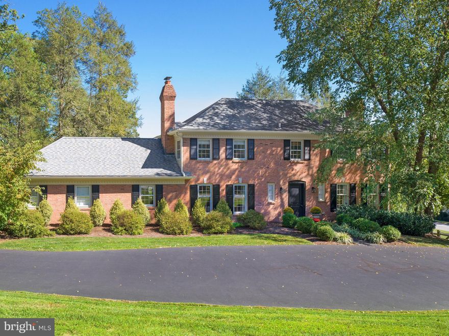 In a quiet, walkable Radnor Township neighborhood, this beautifully updated home blends timeless architecture with modern function, offering nearly 3,300 square feet of inviting, move-in-ready living space.

From the new front entry, custom woodwork, fresh brickwork, and a flagstone walkway framed by professional landscaping, step into sunlit interiors with high-end finishes throughout. The living room, anchored by a wood-burning fireplace, offers a comfortable place for conversation or quiet evenings.  At the heart of the home, the kitchen is fantastic for cooking and family dinners, a generous island for coffee, homework, and casual meals surrounded by custom cabinetry and marble counters. Premium appliances, Sub-Zero refrigerator/freezer, Wolf induction cooktop (2023), Wolf and Dacor ovens, Bosch dishwasher, elevate function. From the kitchen, French doors open to a flagstone patio and pergola-covered outdoor dining area, creating true indoor-outdoor living. Adjacent to the dining room, a butler’s pantry/bar with wine and beverage refrigerators, sink, second dishwasher, and abundant storage keeps entertaining seamless. The bright and welcoming dining room, enriched with grass cloth wallcovering, hosts everything from casual meals to larger gatherings, and it flows naturally into the family room, a relaxed gathering spot for movie nights, reading, and weekend lounging.

Rounding out the main level, a private first-floor suite features a new white marble bath and its own exterior entrance, providing flexibility for guests, an au pair, or a quiet office retreat. Finally, the mudroom keeps the entire family organized with plenty of storage in the custom cabinetry.

Upstairs, the primary suite offers a serene escape, with a recently renovated white marble bath, gold fixtures, dual sinks, and custom Plato cabinetry. The primary suite also features two ample custom closets. Three additional bedrooms are bright and well appointed, complemented by custom window treatments.

The finished walkout lower level expands daily living and entertaining and features a relaxed lounge with bar and seating area and plenty of flexible space for larger gatherings, exercise, and working from home. Enjoy indoor-outdoor entertaining by opening the double French doors onto a brick patio and the fully fenced yard, which is perfect for gatherings, play, or pets.

Extensive updates bring confidence and style: new roof on the kitchen addition (2025), full exterior repainting and brick repointing (2024–23), new gutters (2024), yard fully enclosed with post-and-rail fencing (2021), recessed lighting throughout, and professional landscaping front and back. Inside, details include grass cloth wallpaper, custom window treatments in the kitchen and bedrooms, and new washer/dryer (2024).

All of this sits on a quiet street where neighbors walk and ride bikes, yet trains, restaurants, and shopping are just minutes away.