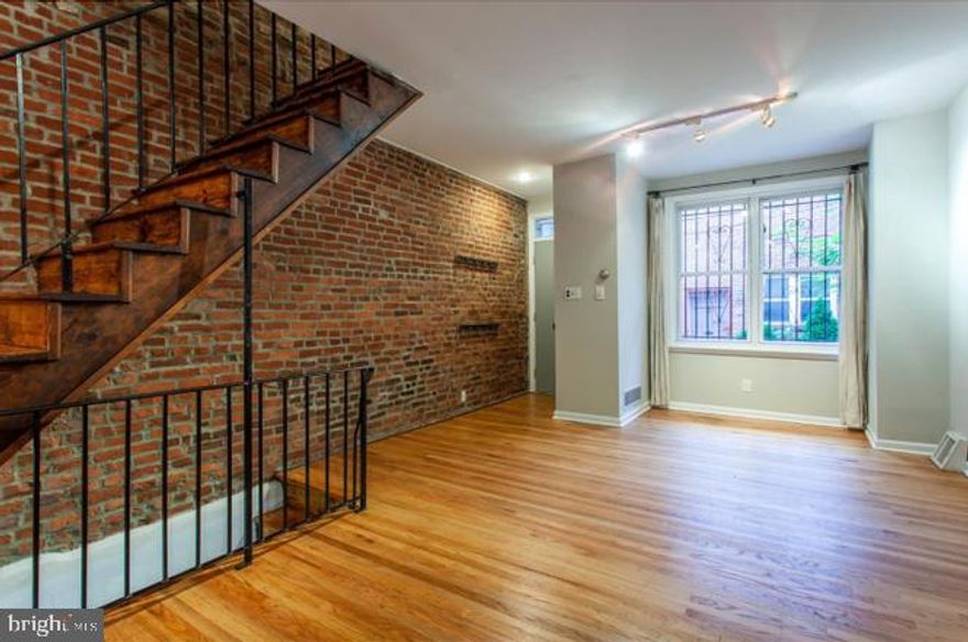 Nice brick townhouse on a tree lined street, just steps to restaurants, shops, coffee houses & Meredith School. Foyer entry with closet leads to full floor living room with half bath and slider to large patio with 
 great size garden and two sheds. The lower level has the kitchen with generous counter space and a separate dining area. Also, a utility room with large capacity laundry & mechanicals. The upper levels have 3 spacious bedrooms with good size closet space and bath with double vanity sink, linen closet and then a south window. High ceilings, exposed brick walls, oak floors throughout and tons of Light from beautiful large windows. Freshly painted and ready!