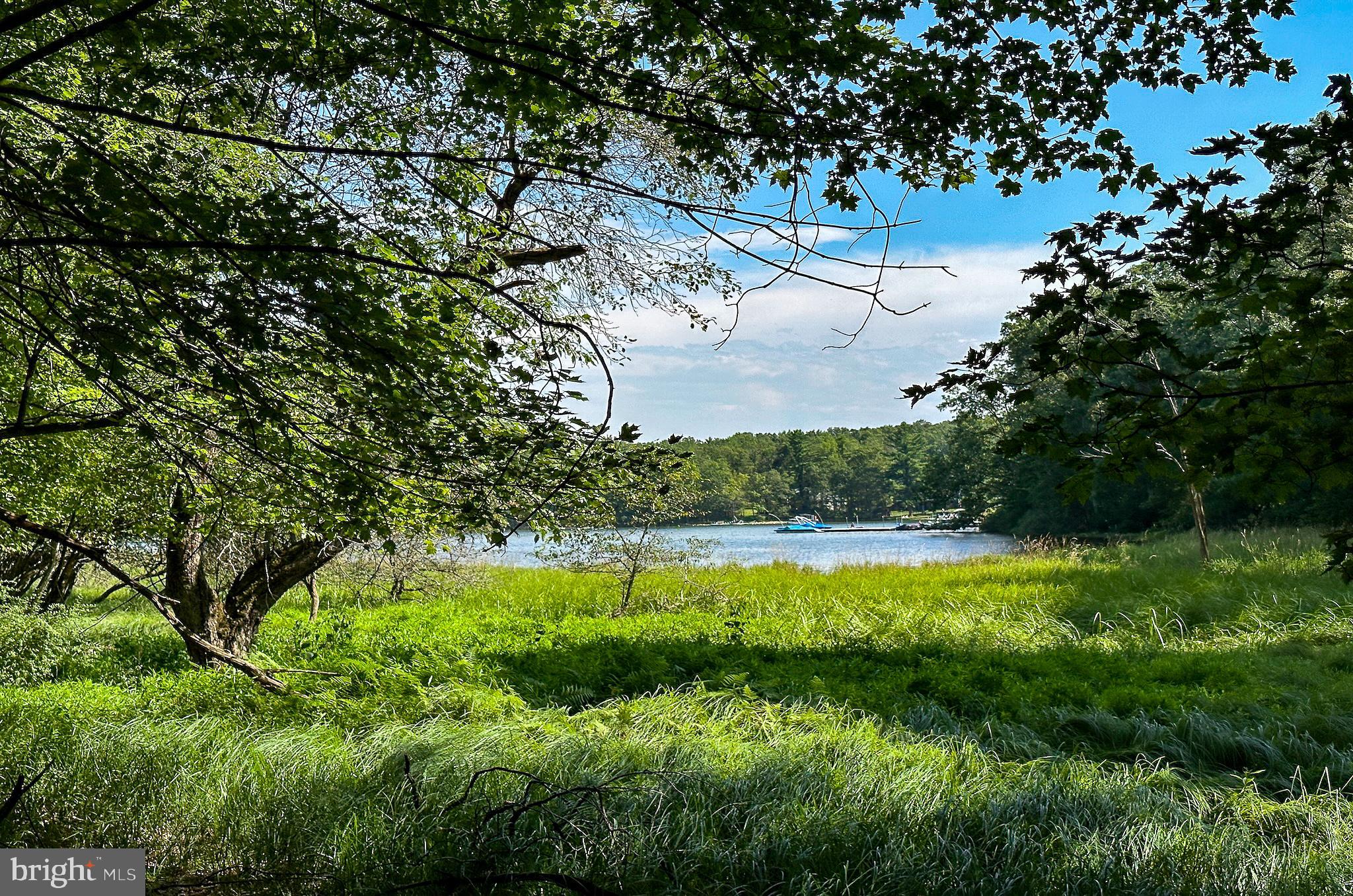 Discover the perfect blend of privacy, prestige, and natural beauty with Lot 25 in The Reserve at Holy Cross—a premier wooded lakefront homesite tucked into a serene private cove on Deep Creek Lake. Boasting 1.34 acres and an impressive 251 feet of lake frontage, this exceptional lot offers the ideal setting to build your dream retreat. Enjoy direct access to the water with two dedicated boat slips at the community’s nearby lakefront HOA use area. Located just minutes from Wisp Resort and the area's best dining, adventure, and entertainment, this property also comes equipped with a public sewer tap and an existing water well. Embrace lakefront living in one of Deep Creek's most coveted communities.