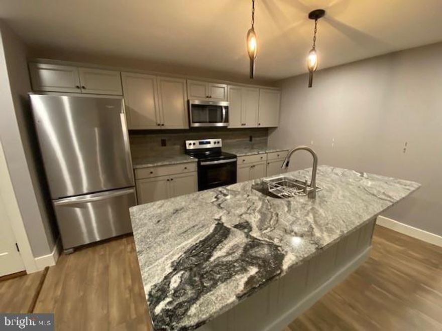 Recently renovated Open Floor Plan apartment located in Ottsville. Lease price will include Water, Sewer, Trash and Lawn Care. Tenant will pay electric. Renovated top to bottom in a high quality, high class manner. Gourmet kitchen with granite tops, stainless steel appliances and center island. Sprawling living room with modern ceiling fan and recessed lights. Master bedroom offers a walk in closet with washer and dryer. Full bathroom  with high end features and tile shower. Off Street parking spot and a small covered front porch. Walk to the Ottsville in and Brig O'Doon Coffee House. No pets, please. Owner will be looking for good credit and good income, no exceptions.