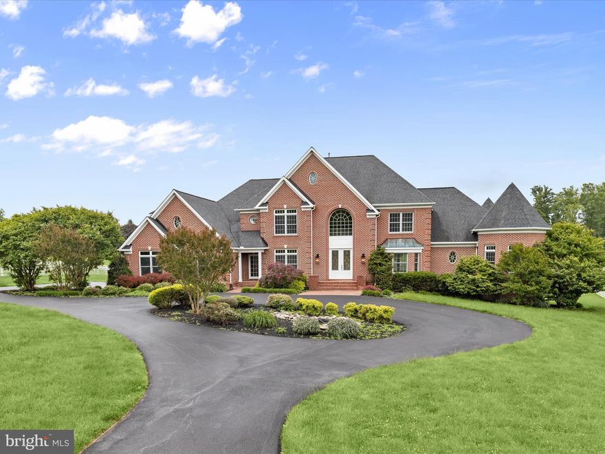 Nestled within the prestigious enclave of The Paddocks, this completely renovated and exquisite residence redefines luxury living. Spanning an impressive 10,000+ total square feet, this architectural masterpiece, constructed in 2000 with enduring brick elegance, offers a harmonious blend of sophistication and comfort. Step inside to discover a grand foyer that sets the tone. Gleaming hardwood floors leads you to all areas of the home . The home office is secluded to the left but go across the entry to the beautifully painted living room and dining room rich with crown moldings and hardwood floors. The gourmet kitchen is a culinary enthusiast's dream, equipped with top-of-the-line appliances, new quartz top island, new white cabinetry, new floors and ample space for culinary creations, seamlessly flowing into elegant dining and living areas that invite gatherings and celebrations. Enjoy the tranquil views of the beautiful backyard from the eat in kitchen that opens to the family room bathed in natural light by the surrounding windows. The two-story family room ensures convenience but the stunning fireplaces throughout the home is perfect for cozy evenings and entertaining guests in style. A large rear deck for entertainment, cookouts, or just relaxing is just off the family room and eat-in kitchen. A main floor primary suite with its own 2nd level sitting room and a new bathroom, laundry room, and 3 car garage completes the first floor. Upstairs boasts 5 additional generous sized bedrooms, each with its own completely renovated bathroom. For additional living space, the fully finished basement provides just that. Set on a sprawling 3.14-acre lot, the outdoor space is a private oasis, ideal for serene relaxation or grand outdoor events. The attached three-car garage and generous circular driveway provide ample parking for guests, enhancing the ease of entertaining. This property is not just a home; it is a lifestyle, offering unparalleled luxury and exclusivity in a tranquil setting. Experience the epitome of refined living in The Paddocks, where every detail has been thoughtfully curated for the discerning homeowner. Great commuter location, close to major routes, shopping, restaurants, parks, schools, even a golf course across the way!