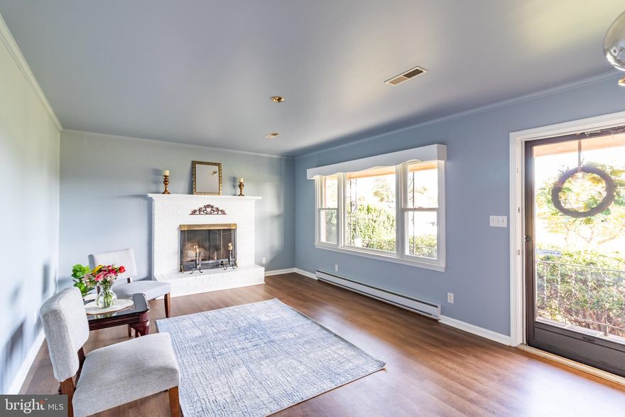 Welcome to your dream home! Enjoy the inviting main floor and the modern basement.  As you drive up to your long driveway enjoy the peaceful view of the half acreage lot.  Your new space for hosting features a brand-new stainless steel refrigerator, fresh cabinets, a new stove, new countertops, new tile, recessed lighting, and has been newly painted. The bathroom includes new tile in the shower, a new sink, a new toilet, and new light fixtures. The two extra rooms in the basement can be utilized as offices or play areas. Your laundry space is equipped with an upgraded washer and dryer (2025), a more recent water heater, and a new sump pump. The delightful main floor presents you with newer flooring (2023), a warm fireplace, updated windows, two full bathrooms, and a bright kitchen. Relish every season in the tranquil backyard. Your search for the perfect home has come to a close!