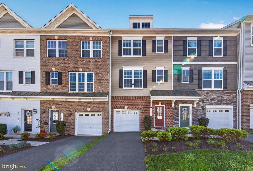 Welcome to this beautifully maintained, nearly-new townhome in the highly sought-after Haymarket Crossing community! Built in 2017 and gently lived in for just one year, this home shows like a model and is truly move-in ready.
Step inside to a bright, open-concept floor plan filled with natural light and enhanced by gorgeous wood floors throughout the main level. The gourmet kitchen is a standout feature, boasting sleek stone countertops, stainless steel appliances, a spacious island, pantry, double oven, and built-in microwave—perfect for both everyday living and entertaining.
Enjoy seamless indoor-outdoor living with sliding glass doors that open to a spacious rear deck—ideal for morning coffee or evening relaxation.
Upstairs, you’ll find two luxurious primary suites, each complete with its own full bath and walk-in closet—perfect for privacy and flexibility. A third bedroom with a full bath on the lower level makes an ideal guest suite, home office, or additional living space. Brand new front-loading washer and dryer conveniently located on the upper level.
Freshly updated with new carpeting and paint throughout, this home also includes a 1-car garage and ample storage.
Unbeatable location just minutes to I-66, Route 29, and Route 15, and within close proximity to shopping, dining, Wegmans, Starbucks, Walmart, and the hospital. Located in an excellent school district.