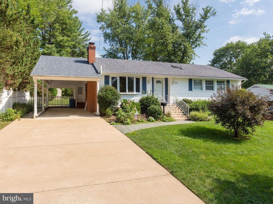 Welcome Home! Located in the desirable Lake Braddock school tier and just one stoplight to I-495, this beautifully updated home features a rare family room addition, providing you with ample space for everyday living or effortless entertaining. Inside the freshly painted home, discover a sizable living room with recently refinished hardwood floors, a cozy fireplace, and a large picture window flooding the home with natural light. The adjacent dining room opens directly into the bright kitchen, featuring updated cabinets, sleek quartz countertops, and a fresh tile backsplash. Pass through the french doors to the expansive family room, where you’ll find a dramatic vaulted ceiling, plush carpeted floors, a second gas fireplace and wall-to-wall windows. Down the hall, the primary bedroom is a calm and elegant retreat with crown molding, ample closet storage, and a renovated en suite bathroom with modern finishes. Both additional bedrooms feature abundant closet space and share access to the second remodeled full bathroom in the hallway. Downstairs, the vast carpeted recreation room with recessed lighting is a great versatile space with endless opportunities to fit your lifestyle. The fourth bedroom and elegant third full bathroom on the lower level offer a perfect private space for guests. Rounding out this level of the home is a large storage area, plus an additional walk-in closet and massive laundry room with double utility sinks. Step onto the deck off the family room or pass through the mud room door, and enjoy the lush tree-lined view that surrounds you. This large and flat backyard is ideal for relaxing, playing, or entertaining all Summer long. With a rare carport, ample parking, and so much space, you’ll want to invite friends over to grill or watch the big game every weekend! Major home updates include a new water heater and HVAC (2021) for greater peace of mind. No HOA in this established, close-knit community, though an optional community pool membership is available. Just minutes to Giant, Safeway, Whole Foods, Old Keene Mill Shopping Center, Springfield Plaza, Lake Accotink Park and Trails, Hidden Pond Nature Center, and Springfield Country Club. Quick access to I-495, Braddock Road, Old Keene Mill Rd, the Fairfax County Parkway, and WMATA Express Bus, making it a dream for commuters! In the desirable Lake Braddock Secondary School tier, this updated home won’t be available for long. Schedule a private tour of your beautiful new home today! Offer deadline Tuesday 5/20 @ 5pm