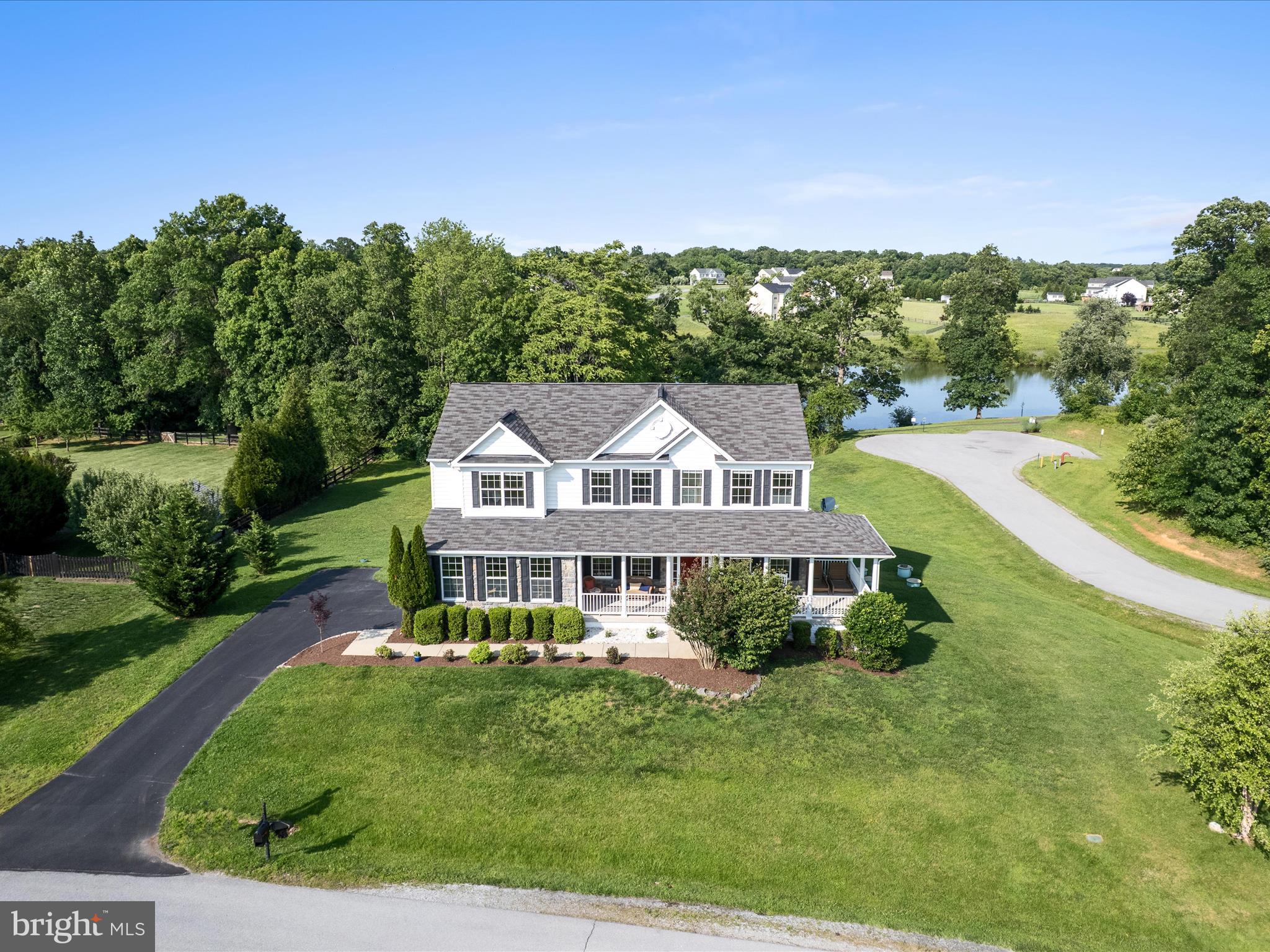 Your waterside home awaits you in Purcellville, Welcome to 36522 Winding Oak Lane!
Tucked at the end of a quiet cul-de-sac, this beautiful home with a wrap around porch, sits along a peaceful pond where you can kayak, fish, or simply enjoy the water views from your own backyard. A walking trail encircles the pond, offering the perfect spot for morning jogs, evening strolls, or a moment of quiet in nature. From nearly every window in the family room, basement, and upstairs, you’ll enjoy panoramic views of the peaceful water and lush trees year-round.
As you head inside, you are welcomed to beautiful hardwood floors, a two-story family room filled with natural light, and a cozy gas fireplace. The open kitchen flows seamlessly into the living space ideal for gatherings and everyday living. The main level also features a dedicated, home office with water views, laundry room, and two-car garage.
Recent updates include fresh paint throughout, brand-new carpet, and a new microwave (2025), making this home move-in ready. The walk-out basement, also freshly painted, adds a spacious rec room, an additional 5th bedroom, and a full bathroom, perfect for guests or multi-generational living.
Step outside to your private backyard oasis with a large deck, finished patio, and fire pit for entertaining and with lake access just steps away, your weekends can be filled with paddleboarding, kayaking, or simply soaking in the views.
All of this is just minutes from downtown Purcellville, scenic hiking trails, local wineries, breweries, shopping, dining, and commuter routes. This is a one-of-a-kind opportunity to enjoy lakeside living in Loudoun County, all for under $1M