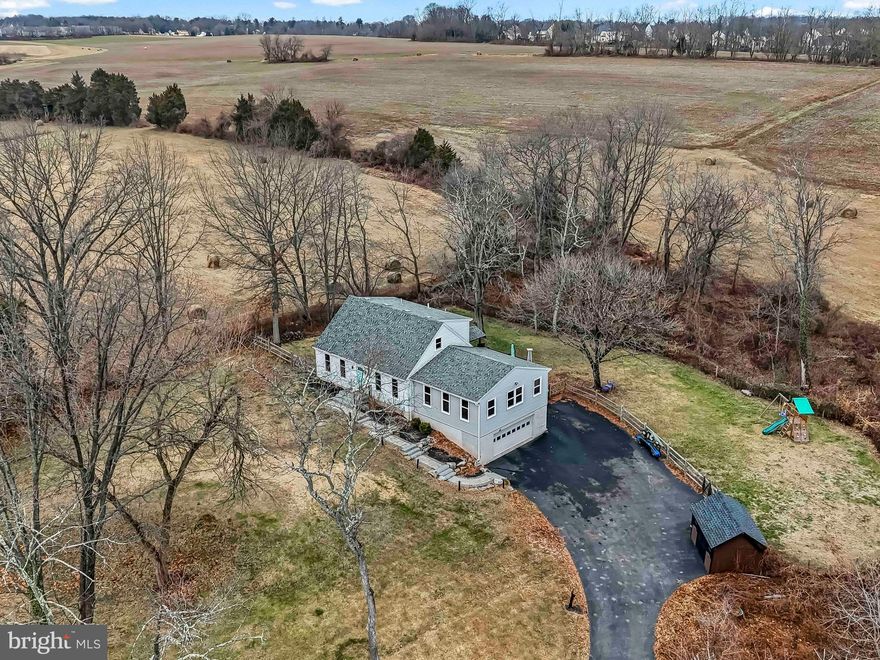 Stunning  4 bedroom/2 Full Bath on 1.12 acres located in historic Trappe Borough. This fully updated Cape Cod combines all modern updates and amenities you would expect with new construction but without the new construction price in  setting surrounded by farms and open space.
Updates include but not limited to: Professionally finished basement(2025), new Kitchen appliances(2025), new Family/Living room windows(2025), newer whole house windows(2019), full bathroom updated(2023), new/expanded/rebuilt driveway(2021),  newer Living room and bedroom flooring(2021), newer roof(2019), newer HVAC(2022), and newer post/rail fenced-in rear yard(2021). Professional tree removal(2025), new electrical panel(2025) with outside generator port and newer sheds for extra storage and much much more. 
The main floor offers both an open and traditional floor plan with neutral themes and tastefully decorated. Gourmet Kitchen complete with granite countertops and tile backsplash plus all new  LG appliances(2025), two sinks, updated and lighted high end cabinetry and a built-in portico that looks out into dinning room. The spacious Family Room(22x25) connecting to the gourmet Kitchen and large Dining Room are ideal for large  gatherings and entertaining. Two nicely sized bedrooms and full bath suited for multigenerational housing needs complete the main floor plus an additional 2 bedrooms and full bath upstairs.
The spacious composite rear deck off the Living Room offers breathtaking views of farmland and protected open space and the lower rear paver patio is easily accessible with steps from rear deck or from professionally finished lower. Lower level uses include game room, Family room, Office  and home gym. Rear fenced-in rear yard, backing up to open space,  allows for a great play area for children and pets.  Attached and  oversized 2-car garage with electric charging port plus plenty of driveway parking. Public water and sewer tie-ins available. 
Award winning Perkiomen Valley schools, low taxes, updates galore and easy access to all major routes plus a one of a kind country setting.  PERFECT is the  word that describes this lovingly maintained and updated country Oasis!