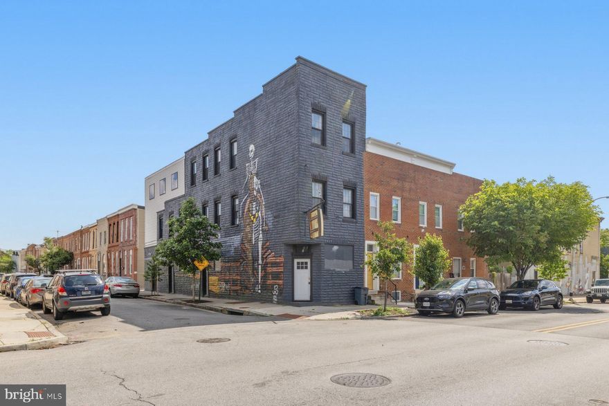 So much potential with this versatile and highly visible end-unit mixed-use property located in Pigtown.  This prime location offers incredible potential for investors, entrepreneurs, or anyone seeking the perfect live-work space with flexible zoning to accommodate a small business, trendy residence, or a combination of both.  Buyer to verify this with the city.  Boasting the highest rooftop line on the block, the property features a spectacular rooftop deck perfect for entertaining, alongside a charming sunroom  area that showcases breathtaking panoramic views of downtown Baltimore and the historic B&O Railroad. On the second and third levels, you will find two modern apartment units complete with spacious layouts, contemporary finishes, and sleek granite countertops that ensure upscale, comfortable living. Situated in a vibrant neighborhood, this unique property provides the ultimate canvas to maximize your rental income or bring your creative business vision to life.  There's endless opportunities at  1001 S. Carey St., Make your appt today!