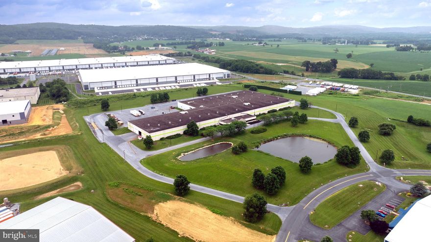 Freestanding warehouse/manufacturing facility located within the Lebanon Valley Business Park in South Lebanon Township. Located 15 minutes from the nearest access to the PA Turnpike, this property offers ample on-site parking, well-appointed office space, locker rooms and breakrooms, heavy power, one (1) dock-height door and seven (7) grade-level loading doors. Also includes a truck scale rated up to 120,000 pounds.