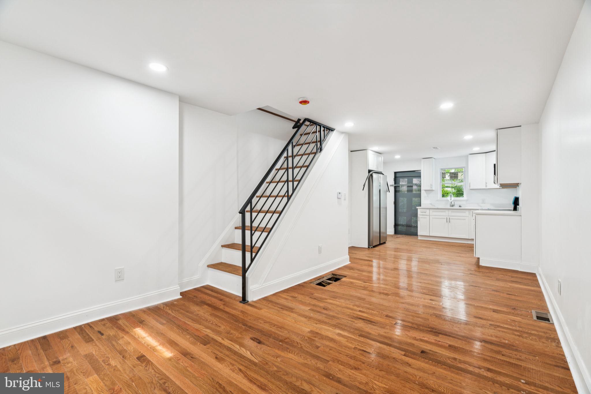 Thoughtfully renovated 2-bedroom, 1-bathroom home located in Frankford. Blending timeless character with modern upgrades, this home offers the perfect mix of historic charm and contemporary style. Inside, you’re greeted by wide plank solid hardwood floors, open concept living room and kitchen areas. The kitchen is as functional as it is beautiful, boasting an extended quartz countertops, shaker-style cabinetry, designer hardware, stainless steel appliances. Out back, a private rear patio offers the perfect space for outdoor dining, gardening, or relaxing under the city lights. Upstairs, you'll find two comfortable bedrooms and a well-appointed full bathroom featuring a tiled tub surround. The primary bedroom includes an expanded closets and plenty of natural light. The unfinished basement provides additional space for a home office, gym, or storage.