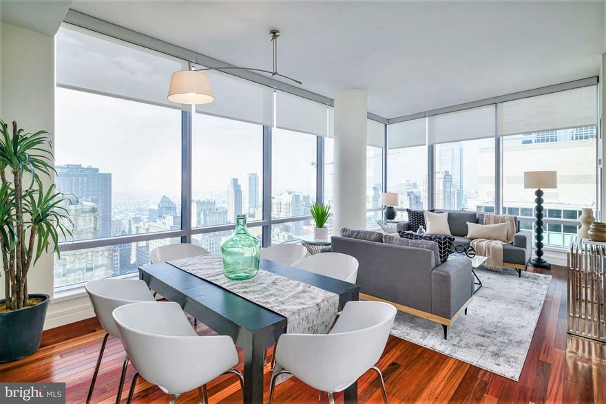 THE ULTIMATE IN LUXURY with COVETED GARAGE PARKING INCLUDED ($100k+ value) – Enjoy magnificent city skyline views from this exceptional corner two bedroom, two and a half bath residence in the sky. Soaring 34 stories above the city, this stunning home  showcases over 1,460 square feet of gracious living space and includes a coveted on-site GARAGE PARKING space. An impressive gallery opens up to an expansive living and dining area showcasing ten foot high ceilings, and walls of windows which flood your space with an abundance of natural light. The chef's kitchen boasts ample cabinetry, SUB-ZERO, VIKING and MIELE appliances, and an oversized breakfast bar, perfect for entertaining. The primary bedroom features a walk-in closet and access to a lavish marble bathroom with double sinks, a large BAIN ULTRA soaking tub, and a separate walk-in shower with frameless shower door. Association fees include a 24 hour concierge, chauffeur-driven car service, state-of-the-art fitness center, pool with hot tub, and residents' lounge with outdoor terrace. Located in the Rittenhouse and Avenue of the Arts area, this pet-friendly residence at THE RESIDENCES AT THE RITZ CARLTON is in the center of it all. World-renowned cultural destinations, one of a kind shopping, exciting nightlife and fine dining are all right at your doorstep.