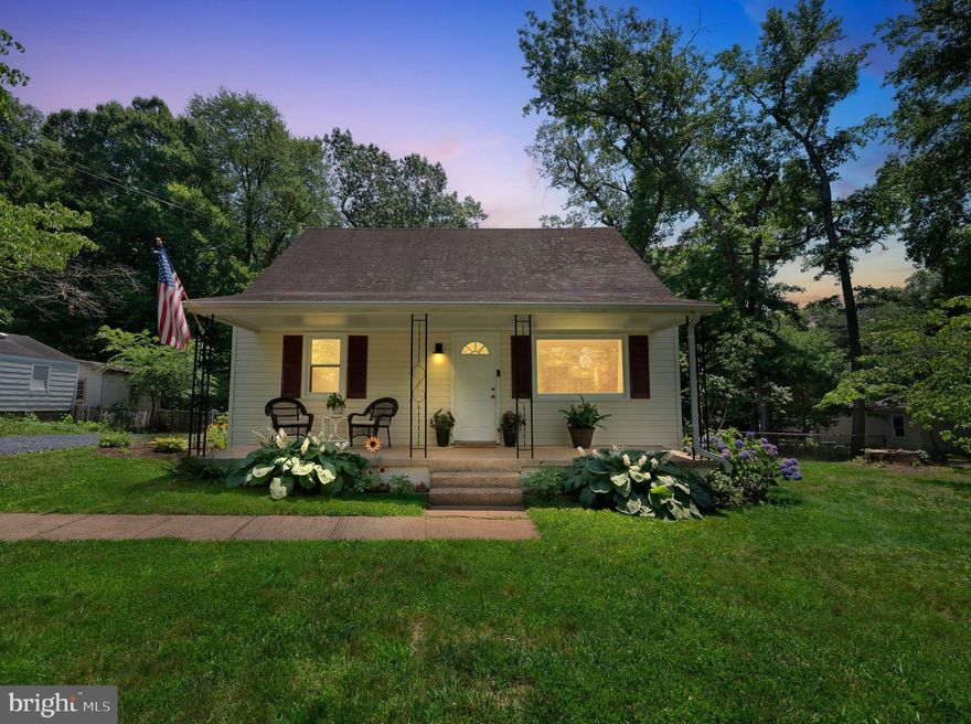 Charming cape cod on almost a half acre lot with 4  bedrooms & 1 full bath . The covered front porch gives this home an inviting entry. Walking in to the 14x12 living room you'll find a light filled space provided by the large picture window and hardwood floors. The dining room has hardwood floors, ceiling fan with light and back up gas wall heater - leads to the kitchen. 19x8 kitchen has luxury vinyl plank flooring, updated lighting, upgraded cabinets, SS stove, SS dishwasher, refrigerator and a breakfast area! The 8x7 laundry room has a newer washer & dryer and lots storage space.  13x12 main level primary bedroom has hardwood floors and crown molding. The second main level bedroom is 12x9 and also has hardwood floors.  The full bathroom has luxury vinyl plank flooring, updated vanity & lights and a ceramic tile surround tub/shower. Up the stairs you'll discover 2 additional carpeted bedrooms. French doors from breakfast area to the 32x13 concrete patio that is perfect for your entertaining needs. Tree cover provides privacy in your fully fenced backyard (drive through gate to back yard) - plenty of room to relax!  The 24x16 work shop is fully wired (modern electric wiring), drywalled, has attic storage and a woodstove for heating! The attached lean to is 24x12 and has a 2 inch foam insulation and pex tubing though the concrete pad ready for radiant heat floor.   Yard is nicely landscaped with numerous shrubs, plants, trees - Dogwood, forsythia, hydrangea, lilacs....  Heat Pump 2019 - Stove 2022 - Dishwasher 2023 - Newer windows - Whole house water purifier - Updated plumbing!  Easy access to commuter routes - minutes to shopping and entertainment!  Trash pickup is included with Water/sewer bill (PWCSA) for $25.50 a month - twice a week pick-up.