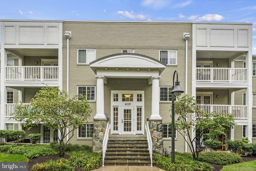 Accessible, spacious and beautifully appointed two-bedroom, two-bathroom one-level condo. Freshly painted, renovated and meticulously maintained home is 100% move-in ready! Enjoy unique, zero stair entry via private, elegant sunroom entry into this one level, accessible home, ideal for all including those with mobility limitations. Bright sunroom is perfect for a home office, plant nursery, playroom or sitting area and enjoys a full wall of windows as well as French door entry with side lite and beautiful hexagonal tile floor. Hardwood floors shine throughout this freshly painted light and bright home with open concept living area. Generously proportioned living room can accommodate large sectional couch, love-seat and more, has enough room for a home office, reading nook or other separate space and looks out into the sunroom. Dining area adjacent to living room and kitchen features enough space for a large dining table and sideboard or additional furniture. Eat-in chef’s kitchen stuns, from the large window overlooking the courtyard, to the attractive gray cabinetry and convenient food pantry. Kitchen also includes glass-front upper corner cabinets, stainless steel appliances, white ceramic tile backsplash and dark stone countertops make for an elevated, contrast inspired chic, home magazine inspired look. The kitchen island with pendant lighting provides a great alternative spot to enjoy a quick meal, perfect spot to have guests involved in the food preparation or just work on a laptop enjoying a cup of coffee. Alternative entrance into the unit from the building hallway leads to a large coat closet, this home features in-unit laundry, a utility closet and an additional closet that can double as a food pantry or a linen closet. Renovated hall bathroom boasts a shower with ceramic tile surround, with glass door enclosure, large vanity and mosaic tile ceramic floor tile. Primary bedroom suite is large enough for a king-sized bed and sitting area, closet with organization system, room darkening shades, ceiling fan and recessed lights and en-suite bathroom. Large en-suite bathroom features an oversized vanity as well as a deep soaking tub with ceramic tile surround. Large secondary bedroom features a closet with organization system, large window with room darkening shades and recessed lighting. West Village of Shirlington is an abundantly convenient place to live, featuring a community pool, community pavilion with grills, updated community/ club house with gym, close proximity to Shirlington Village for shopping, dining and grocery, I395, Amazon HQ2, Washington Reagan DCA Airport and an easy commute into Washington, D.C.