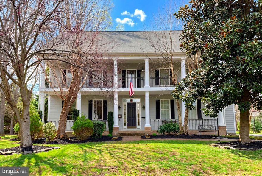 Live & own this lifestyle.  2.75% VA Assumable Loan Available. Enjoy the scenic views of the Potomac River and Golf Course, as you drive to this beautiful Southern Colonial Style home, in the desirable Swan Point Community  & school district.  This custom home has 5 bedrooms, 3.5 bathrooms, 2 car oversized garage, and double front verandas, offering water views. A nice brick & stone walkway lead you to the front door, with nice landscaping, as well. Enjoy panoramic river views & gorgeous sunsets, as you sip a beverage and unwind on your 1st and 2nd story front porches.  As you enter through the front door, you will see a study/den with double french doors, including a gas fireplace, that could also be used as a formal dining room or possible bar area/play/game room.  The gleaming hardwood floors lead you into the open concept heart of the home, the expansive kitchen, with white custom cabinets, granite countertops, tile backsplash, breakfast bar, pantry, roomy table space, stainless steel appliances and tons of natural light.  Entertain family and friends through the arched open doorway, with columns, in the spacious family room, also with a gas fireplace, or head out back through the french door for outdoor games and fun.  Pottery Barn lighting on the first level and transoms above doorways, recessed lighting, walk-in closets and extra storage space, HW and ceramic floors, dual zone HVAC, plus crown molding are just some of the custom features of this home. Ascend upstairs to 5 generously sized bedrooms, with a beautifully laid out primary suite with water views and large walk-in closet. Another spacious bedroom includes a full bathroom.  A 3rd full bathroom and laundry room with utility sink, is also located on the 2nd level, with 3 additional bedrooms.  New roof in 2025 and all new carpet in 2024.  Washer & Dryer only a few years old. The garage has 13 foot ceilings with workbench and storage and easily fits 2 vehicles. Community amenities include outside pool, tennis/pickle ball courts, marina, golf course, snack bar, club house for dinner and bar area, outside patio, beaches, walking/golf cart paths and common areas to enjoy.  Nearby restaurants, grocery/beverage stores, shopping, gas station, firehouse, churches, schools and post office. Dahlgren  Naval Base is just over the Nice Bridge, in King George, Va. Don't miss out on this exquisite home & lifestyle.