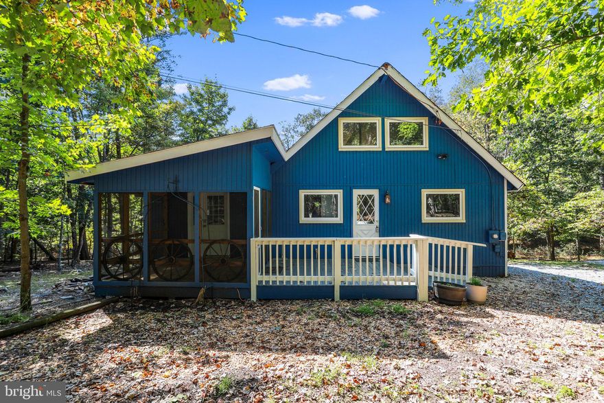 Well maintained Elwood/Chalet home with (2) bedrooms, updated full bath and loft. Beautiful wooded 1.13 acre homesite on cul-de-sac street with lots of privacy. All new windows! Heat pump with central air. Beautiful granite kitchen counters and stainless steel appliances. Fixed glass window wall in the great room with cathedral ceilings, wood laminate floors and cozy gas stove to enjoy those chilly days at The Woods. Dining room off of the great room with vaulted ceilings, wood laminate floors and sliding glass door leading to the new 24×8 open deck. Main level owners bedroom with access to the relaxing 10×11 screened in porch with view of the coy pond. Class B (Indoor-Outdoor) membership available.