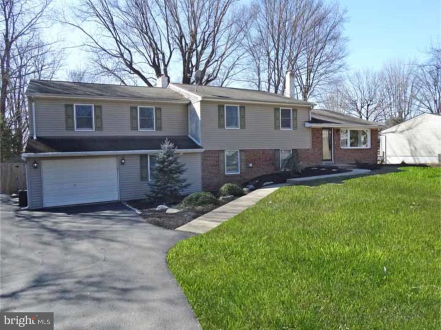 TURN KEY WITH LOWER TAXES AND CR SCHOOLS! Huge inside! Expanded Split Multi/Level home, with spacious lot and in the highly desirable Churchville Manor community .  New entry door leads to bright Living + Dining Rooms w/ hardwood flooring, huge bay windows, + neutral paint colors. Kitchen RENOVATED 2015, w/granite tops, travertine tile backsplash, disposal, hickory hardwoods, newer wall oven, dishwasher and refrigerator, +new door leading to deck. Newly carpeted stairway leads to upper level boasting 4 Bedrooms. Main Bedroom addition is enormous w/ new carpet, a large closet, and built in shelving. Bedroom #2 "suite" has remodeled half bath. 2 additional Bedrooms ?one w/new carpet-, plus a fully renovated full Hall Bathroom w/stone floor+ tiled shower, complete the second level. AMAZING LOWER LEVEL w/enough space for in law suite! Spacious Family Room offers handsome engineered hardwood flooring + attractive/efficient wood burning stove , large windows + a door to the patio. Also included on lower level are 2 Offices, one with built in shelving/desk, a Recreation room w/vaulted ceiling( pool table stays!), a Weight Room, Sitting room, updated full Bathroom with new tile flooring, lighting, mirror and vanity + a large Laundry Room. Exterior has enormous yard w/new cedar fencing, lovely deck, EP Henry brick patio, shed and awesome fire pit!  2009 A/C/heat pump, 2013 high efficiency furnace, 2013 hot water heater, new hardware and 3 new storm doors! All in award winning Council Rock Schools!
