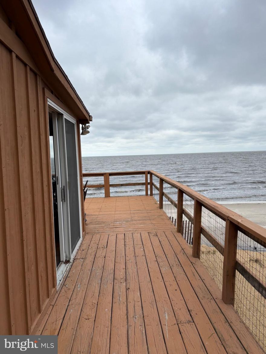 Welcome to Pickering Beach, a small community of beachfront homes along the Delaware bay. This beach bungalow has been lovingly maintained and has a timeless mid century modern design. Enjoy sunrises over the bay from the bedroom and living room or the deck and sunsets along the marsh over the back additional lot. Fishing, Kayaking, clamming and crabbing and of course long walks on the beach with amazing beach-combing are some of the pastimes this property has to offer. Great environment for relaxation and family gatherings, bi annual Air Force show visible from the home as well. Home has an expansive great room, smaller living space off the deck that had been used as an office, kitchen, bathroom and one large bedroom with bay-front views. Windows are Anderson.