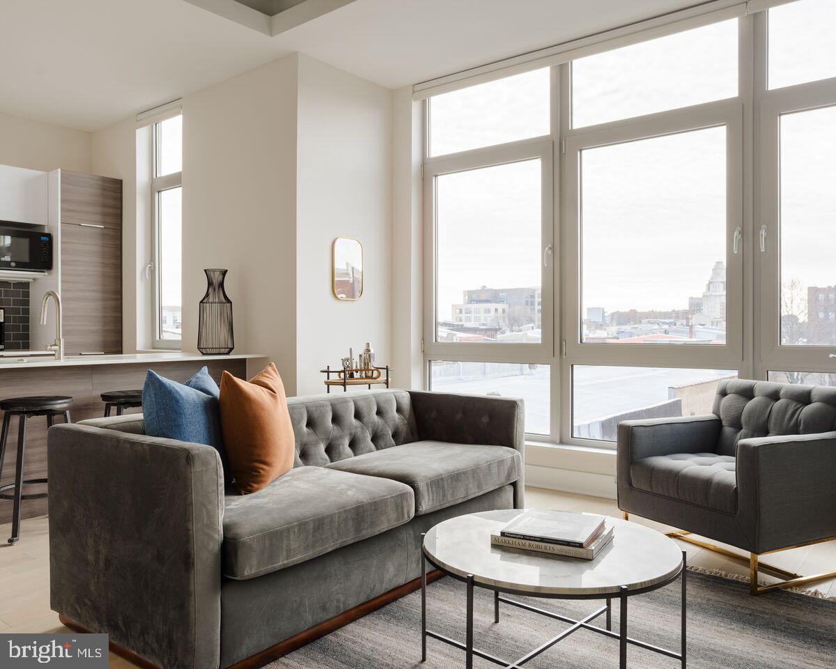 Welcome to 313 Race St., an urban apartment exuding sophistication and comfort. Situated in the vibrant heart of Old City Philadelphia, this stylish 2-bedroom, 2-bathroom residence offers an open floor plan to optimize space and light, it caters to both functionality and style. Available for early May move in. Upon entry, you're greeted by a spacious living area, perfect for entertaining or unwinding. Large windows bathe the space in natural light, creating a welcoming ambiance. This unit has its own private balcony. The sleek kitchen is a chef's dream, featuring modern stainless steel appliances, quartz countertops, and ample cabinet space. Whether preparing a quick breakfast or hosting a dinner party, this kitchen is sure to impress. Master suite boasts a spa-like ensuite bathroom with a beautiful glass-enclosed shower while the second bath has the tub. The second bedroom offers versatility for use as a home office, guest room, or personal sanctuary with spacious built in wardrobe. Built to condominium standards with very high end finishes, sound deadening construction between units, triple pane and glazed windows with remote control window coverings make this not your ordinary apartment building. Outside, discover a world of excitement with trendy cafes, boutiques, and dining options just steps away. Convenient access to public transportation and major thoroughfares makes commuting a breeze. Don't miss your chance to experience the ultimate in urban luxury living. Schedule your private tour today and discover why this modern 2-bed, 2-bath apartment is the perfect place to call home. Amenities include Bike storage, Rooftop Terrace, and Fitness Room. Contact us now to book your viewing!