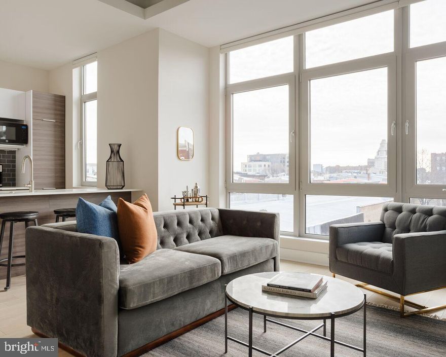 Welcome to 313 Race St., an urban apartment exuding sophistication and comfort. Situated in the vibrant heart of Old City Philadelphia, this stylish 2-bedroom, 2-bathroom residence offers an open floor plan to optimize space and light, it caters to both functionality and style. Available for early May move in. Upon entry, you're greeted by a spacious living area, perfect for entertaining or unwinding. Large windows bathe the space in natural light, creating a welcoming ambiance. This unit has its own private balcony. The sleek kitchen is a chef's dream, featuring modern stainless steel appliances, quartz countertops, and ample cabinet space. Whether preparing a quick breakfast or hosting a dinner party, this kitchen is sure to impress. Master suite boasts a spa-like ensuite bathroom with a beautiful glass-enclosed shower while the second bath has the tub. The second bedroom offers versatility for use as a home office, guest room, or personal sanctuary with spacious built in wardrobe. Built to condominium standards with very high end finishes, sound deadening construction between units, triple pane and glazed windows with remote control window coverings make this not your ordinary apartment building. Outside, discover a world of excitement with trendy cafes, boutiques, and dining options just steps away. Convenient access to public transportation and major thoroughfares makes commuting a breeze. Don't miss your chance to experience the ultimate in urban luxury living. Schedule your private tour today and discover why this modern 2-bed, 2-bath apartment is the perfect place to call home. Amenities include Bike storage, Rooftop Terrace, and Fitness Room. Contact us now to book your viewing!