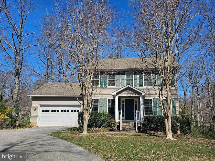 Chesapeake Bay Community! Looking for a place with space? This 2 story home with fully finished basement has loads of space and storage. Main level offers a kitchen with island, breakfast bar, and space for a table in front of the bay window. Formal dining room just off the kitchen could also serve as office space or formal living room. Family room off kitchen is spacious and has door to gated back deck. Upstairs the primary bedroom has a huge ensuite featuring soaking tub, separate shower with stainless surround, and double sinks. The primary bedroom has 3 closets! 1 walk-in plus 2 more! 2 more bedrooms upstairs and another full bath. The basement has a large rec room space has slider to back patio. Just off the rec room is a large hallway leading to a den/office/study and another full bath. You'll find several more closets in the basement too.  The home is sited in the middle of nearly ¾ of an acre so it is set back from the street and has private views out the back. Landscaping features holly, azalea, loblolly, crepe myrtle, nandina, and liriope. Paved drive with ample turn around space leads to oversized 2 car garage that has an extra refrigerator, shelving, and workspace. Community offers access to 2 Chesapeake Bay beaches, the private Lake Lariat, community garden rental space, tot lots, and more. Convenient access to schools, shopping, dining and easy commute to NAS Pax River/Joint Base Andrews/DC, etc. Tenants will need to provide washer and dryer. Pets considered case-by-case. Each person aged 18 years and older must apply separately through Rentspree.