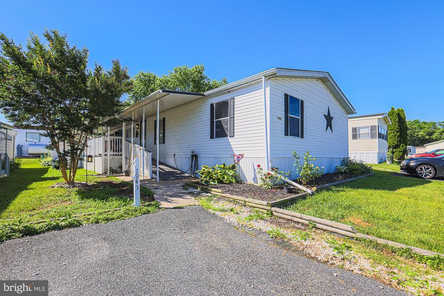 Nestled in a peaceful park setting, this charming mobile home offers comfortable living with a touch of modern convenience. Featuring 3 bedrooms and 2 bathrooms, delightful lighting and ideal layout. Enjoy peace of mind with a brand new roof,  new sub-flooring and plumbing, recently redone tiles in the main shower, waterproof LVT flooring, new carpet in the master and fresh paint throughout! Ensuring years of worry-free living. Covered raised front porch with an additional stone patio area perfect for grilling and relaxing on a breezy summer evening. With its cozy atmosphere and recent upgrades, this home is ready to welcome its new owners.