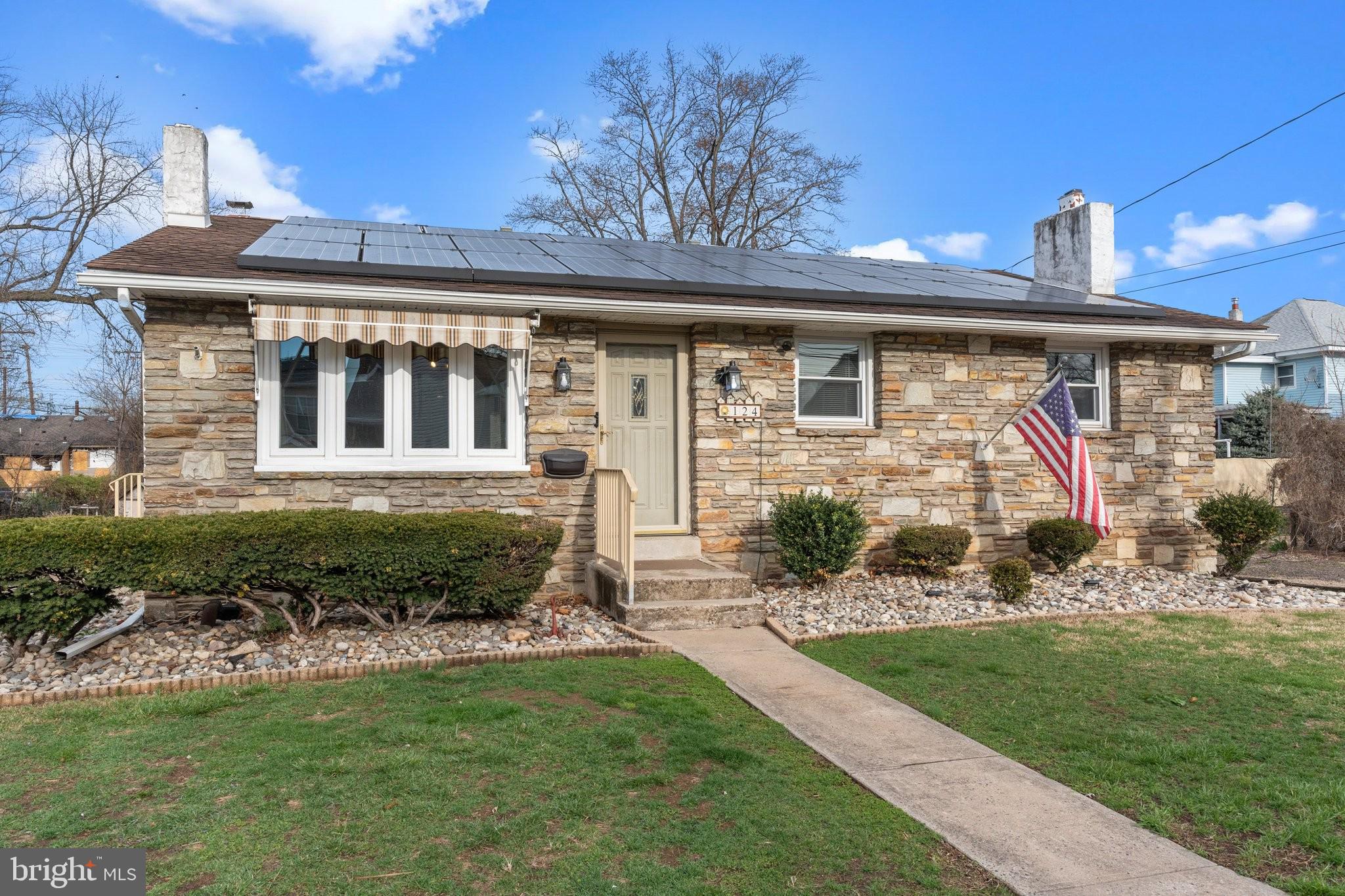 The stone front façade, hardscaping touches, replaced Pella front door, replaced windows, plus a 3-car deep driveway, welcomes you. The quality of construction in this raised ranch shines through! One inside, oak hardwood flooring and a charming beamed ceiling greet you in the Living Room. With bay windows replaced in 2024, built-in display shelving and a tv-height wall outlet in place, furnishing this room will be a breeze. Enjoy the views of the rear yard through top-of-the-line replaced Pella sliding glass doors with built-in blinds and a hidden screen door insert in the Dining Room. A newly installed modern chandelier hangs over the dining table, perfect for get togethers & stool seating was added at the peninsula countertop. Tons of wood cabinetry are provided, along with double ovens and a side-by-side frig with water/ice maker. Neutral Corian countertops, a double sink with window and accent lighting above, plus under cabinet lighting and a neutral ceramic tile lined backsplash add a great touch. A Pella replacement door leads to the side driveway for convenience. The other side of the freshly painted Main Level offers a coat closet, 3 Bedrooms and a full bath. The Master Bedroom is impressive in size with a double closet and dual replacement windows with custom dark-out blinds. The 2nd Bedroom has a deep closet & the 3rd Bedroom has double windows. Each of the Bedrooms boast hardwood flooring, upgraded ceiling fan/light fixtures and stylish curtains. The full Bath has spring-time purple tile accents in perfect condition, a shower/tub combination, window and linen closet. Providing an additional 660 sq ft, the 36’ long finished Basement is open but laid out as 2 areas. The Game Area encompasses a pool table with classic overhead light. All of the extras, like a cue rack and wooden beads for score keeping, are included. The Family Room has a 13’ wide stone accent wall with a gas-fueled DECORATIVE fireplace with track lighting. A ceiling fan/light fixture, built-in speaker wiring and a 2nd zone of heat are features of this bonus space. A 13’x11’ Laundry Room has a wall of cabinetry, stainless sink and a retractable clothes line. Also on this level is: a Workshop housing the replaced heater, workbench, tool peg boards, multiple closets, built-in shelving, a brand new 200 amp electrical panel box and a Powder Room! Right next to a door that leads up to the rear patio, a retro blue/white Arabesque tiled Powder Room is sure to be hit when partying in the Basement or the pool. The rear of the home has a long patio with a 2nd awning. A fully-fenced pool will provide hours of entertainment! Opened and fully-functional last year and ready to be opened by the Buyer post-settlement, this 17’ wide by 35’ long in-ground pool had plaster replaced in 2023. There is a winter safety cover, solar cover, vacuum, chemicals and supplies that are all included. A pond with large koi fish and waterfall is running and beautiful. Attached to the main home are multiple sheds with shelving and electric. The roof is just 10 years young and benefits from a Vivant Solar Panel System which transfers to the Buyer. Economical dual-zone natural gas hot water baseboard heating with an upgraded electronic programmable thermostat on each level. Central air. This home is deep in suburbia, yet just minutes to major cities, airports, train stations and shopping. Quick walk to bars, dining, a Dog Park, fun events at the Delaware River and biking along the Canal. Historic Morrisville is home to Summerseat, George Washington’s headquarters during December 1776, which is owned by 2 signers of the Declaration of Independence. In a town celebrated for its historic events & community feeling, you’ll feel right at home at 124 Harrison Ave! Sellers have completed the extensive list of Use & Occupancy Requirements, including the sewer scope. This home is MOVE-IN READY! Here is your chance to live your summer dream!